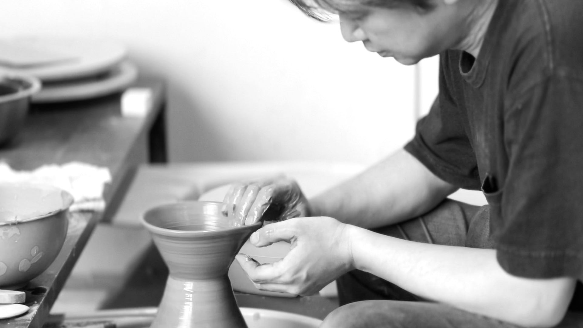 Japanese artisan working on a potter's weel