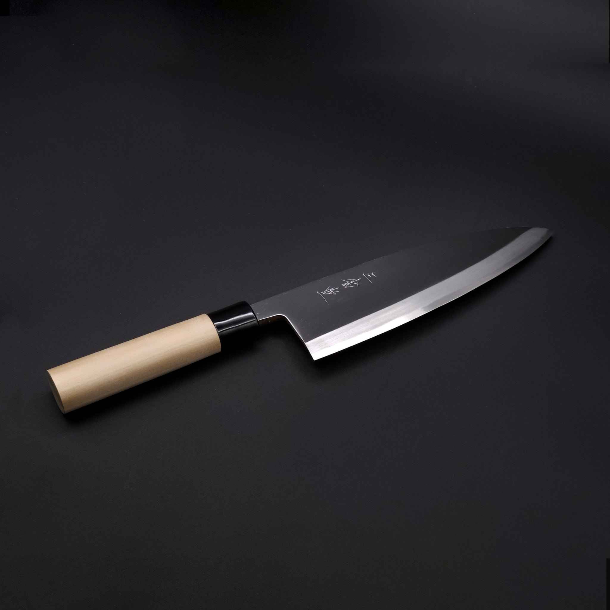 Diagonal view of a 210 mm Aideba Japanese Knife. Tsukushi
