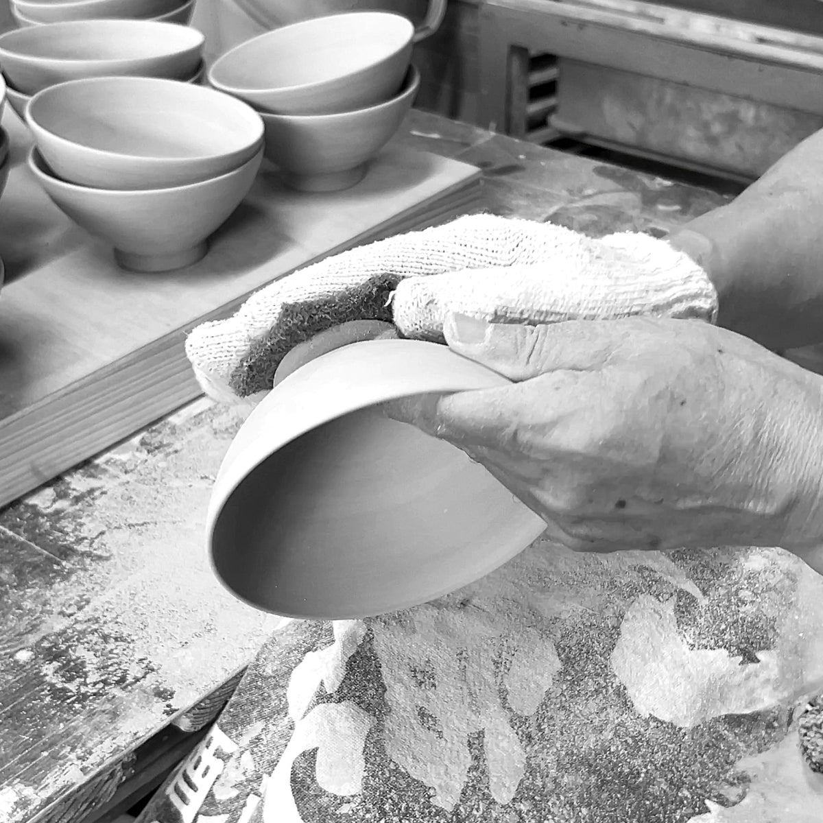 Polishing a Japanese pottery rice bowl. Tsukushi