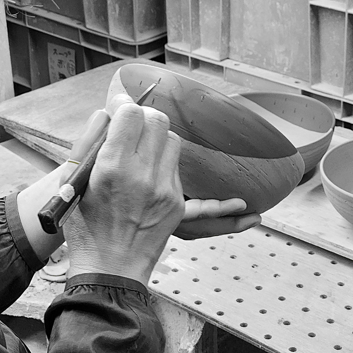 Carving a Japanese pottery bowl. Tsukushi
