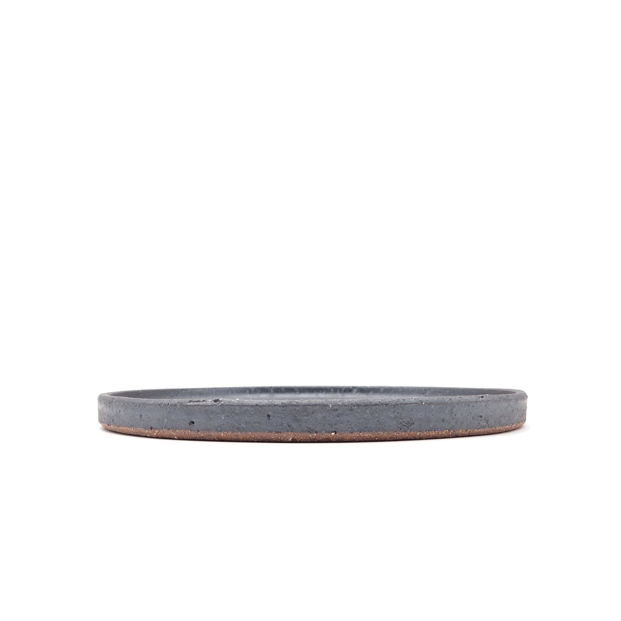 Side view of a black Japanese pottery round Plate 24cm (9.4")