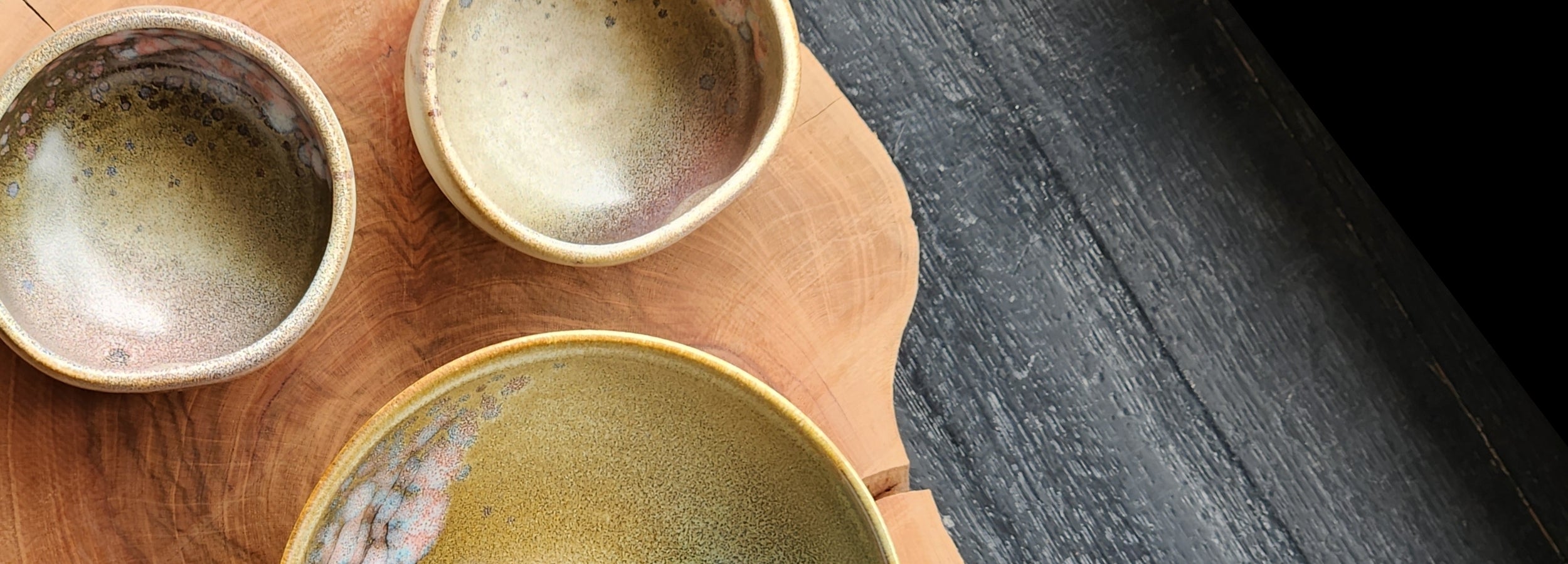 Japanese pottery bowls and cup on wooden stand