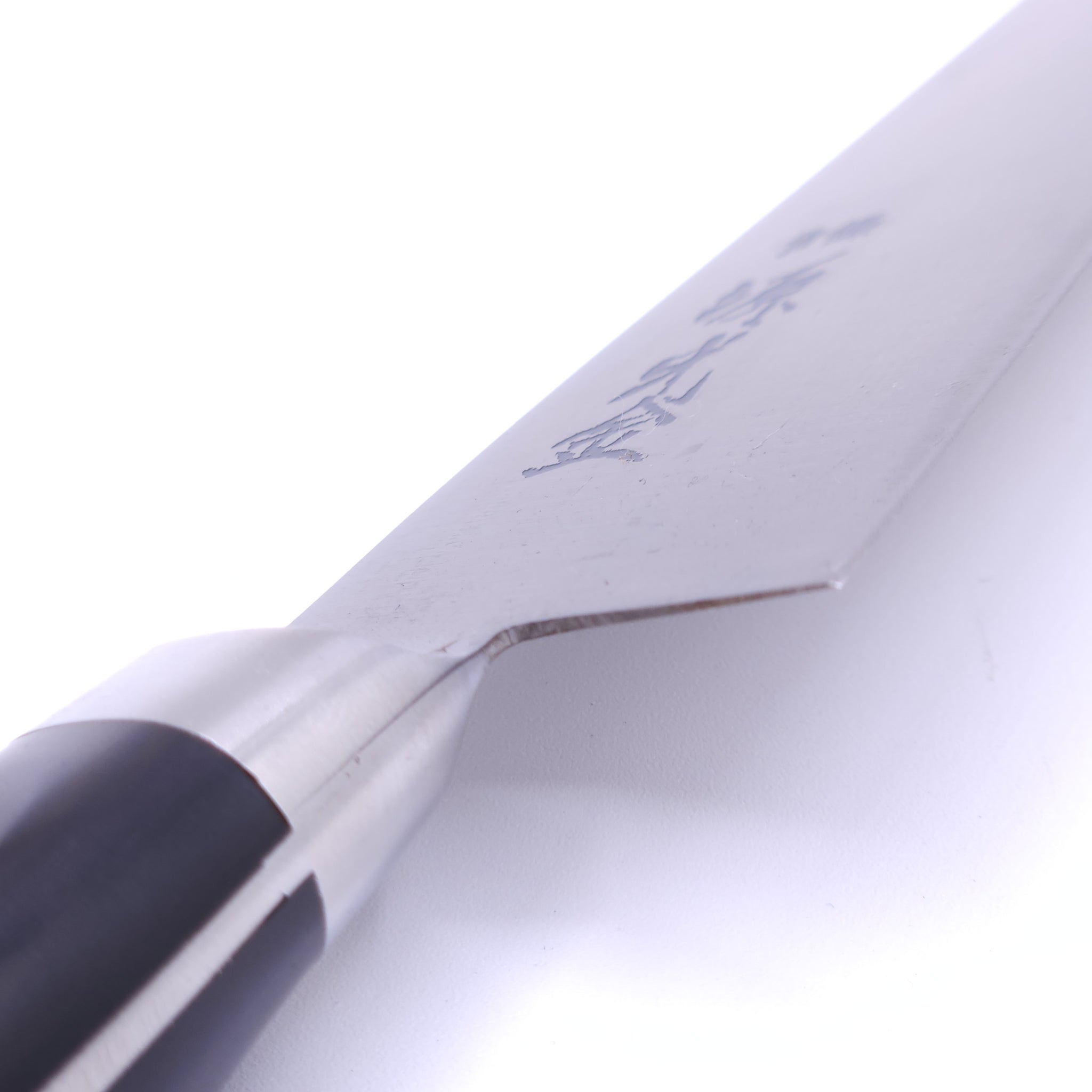 Bolster detail of a Japanese Gyuto knife Crafted in Sk Carbon from Minamoto Mitsukane cutlery,180mm.