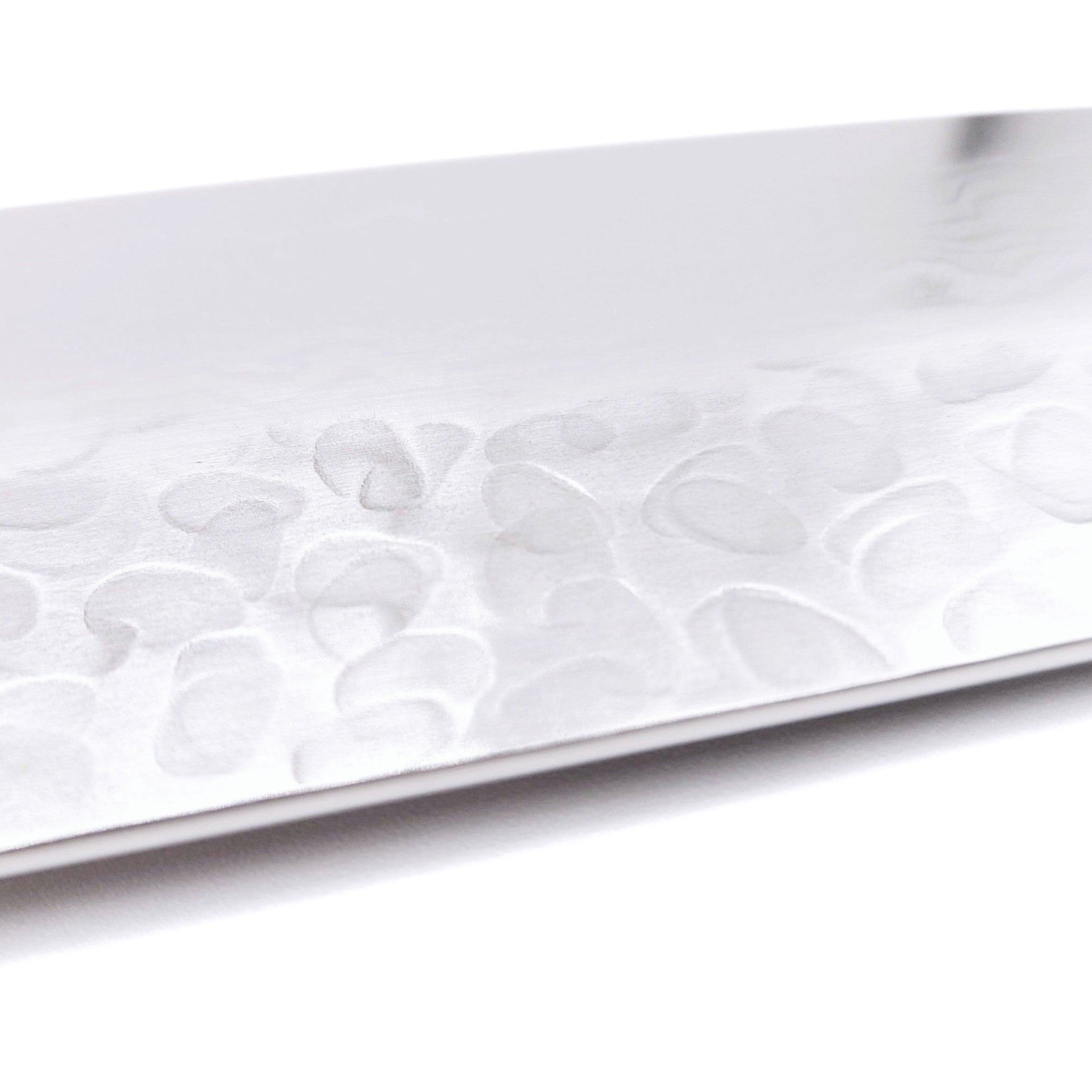 Detail of blade side of a Japanese Santoku Kitchen Knife 180mm