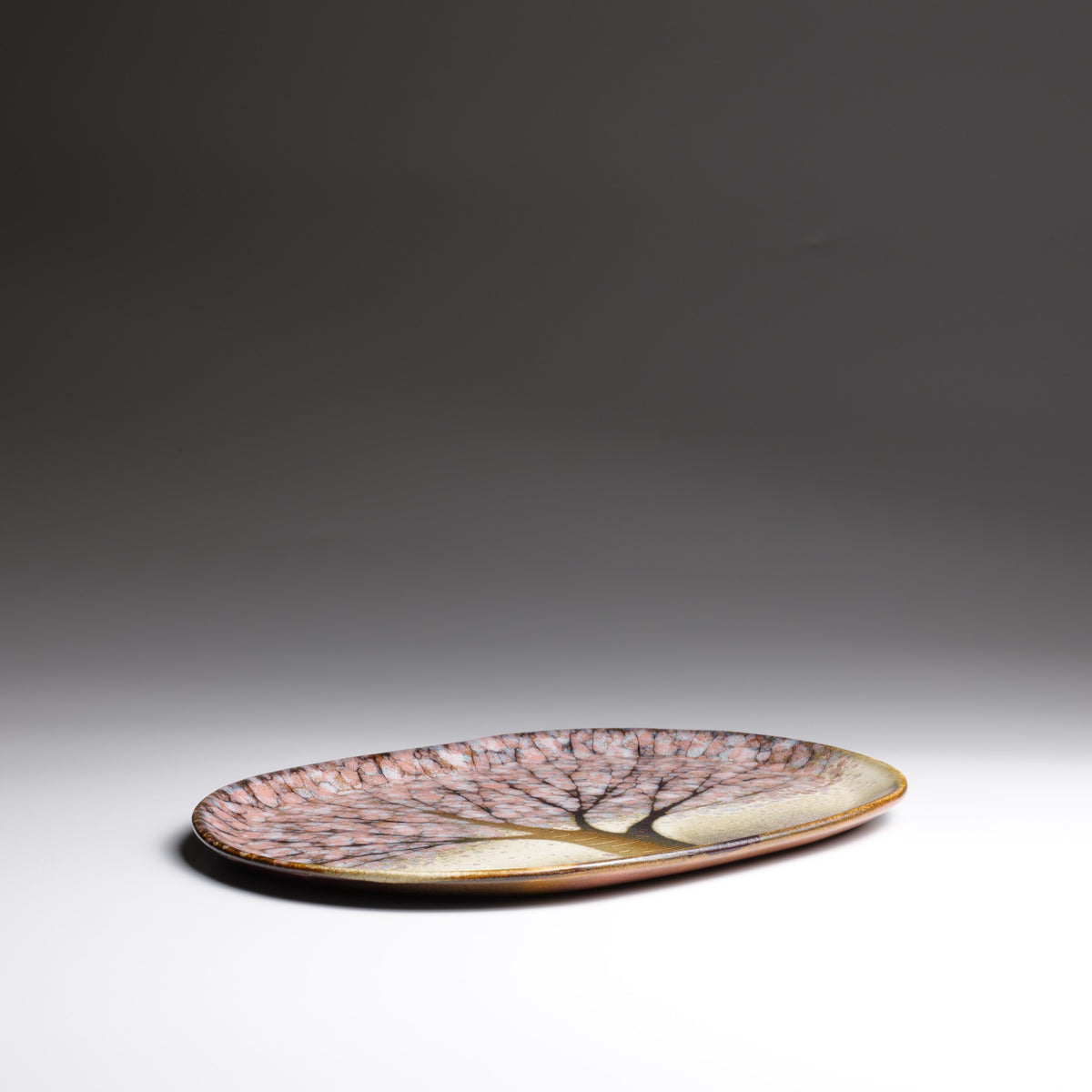 Japanese ceramic plate Hanami , flat front view on a faded background