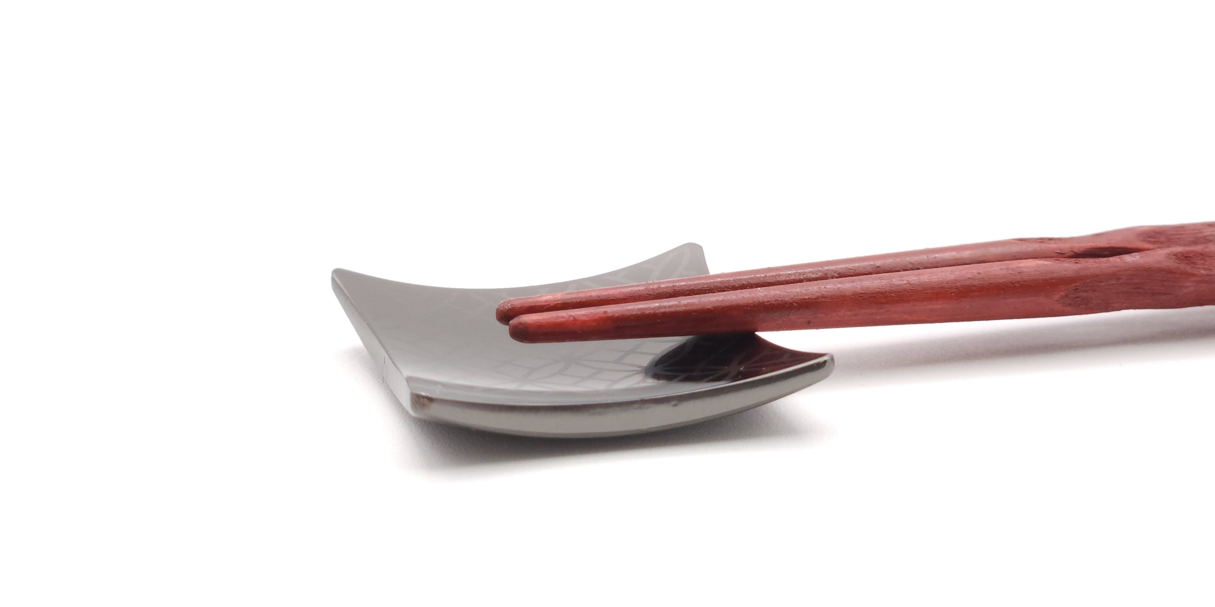 detail of a black Japanese Chopstick rest. Tsukushi