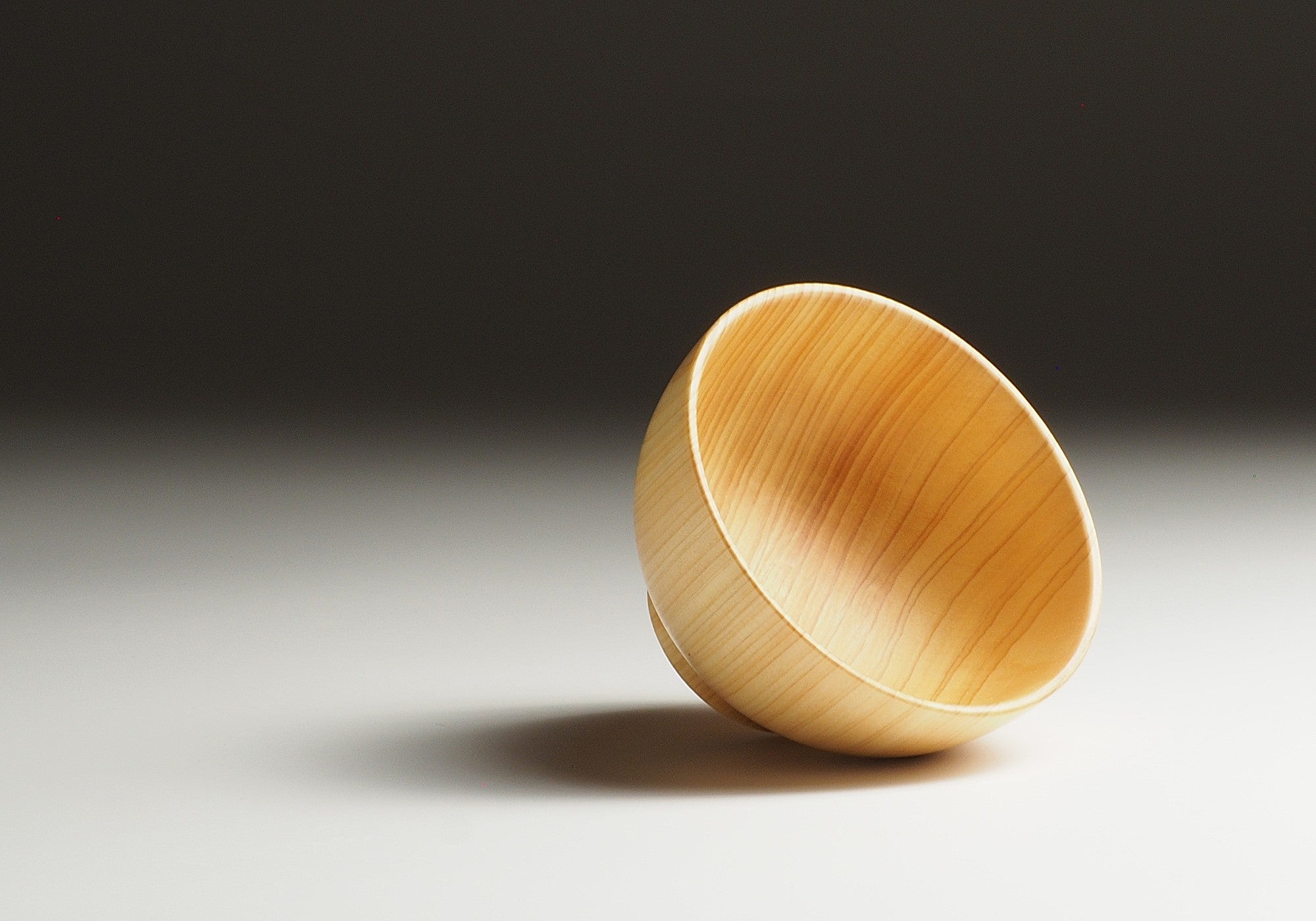 Japanese wooden macha tea bowl on a gradient background. Tsukushi