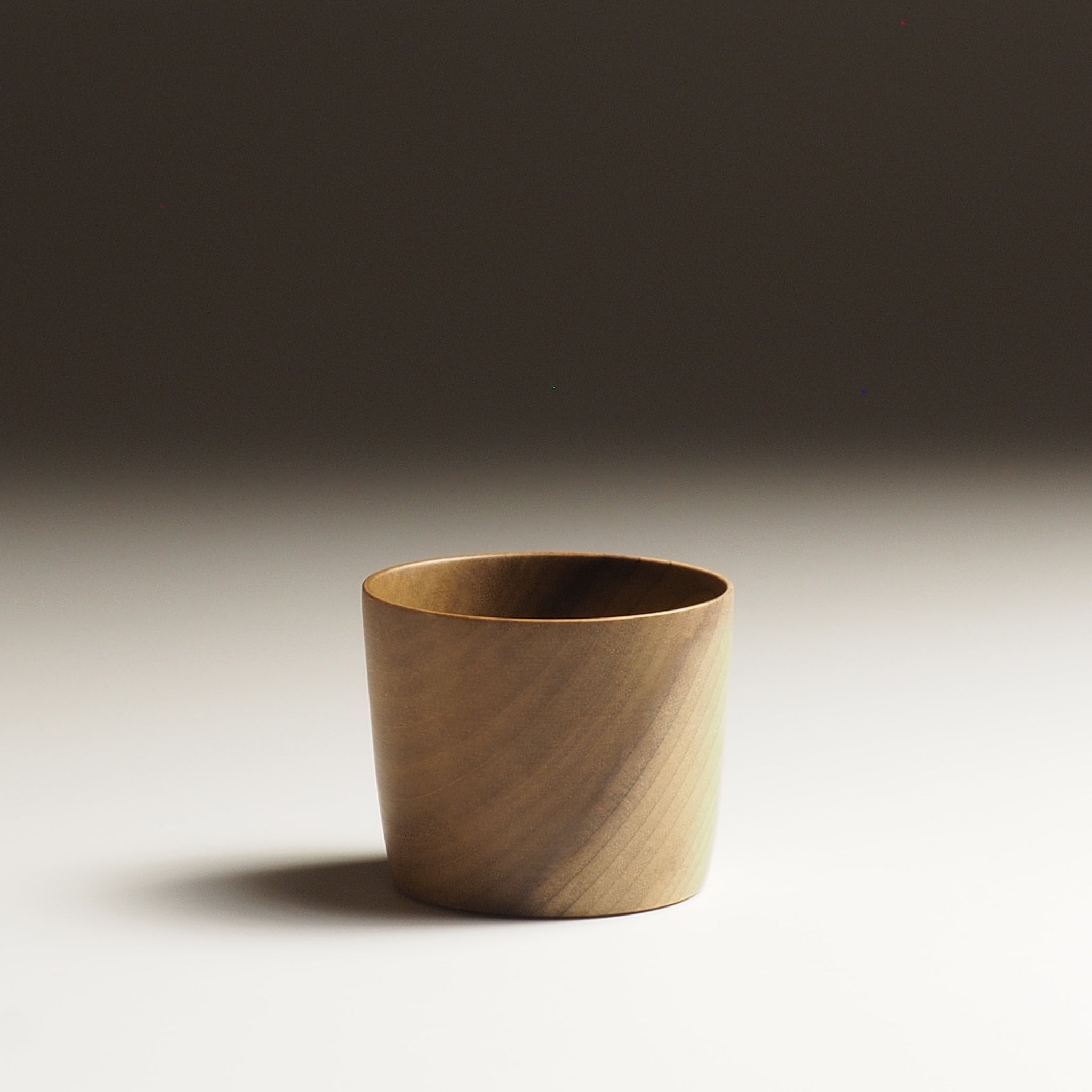 Japanese Cucumber Tree Japanese Wooden Sake cup beige background from side, Tsukushi