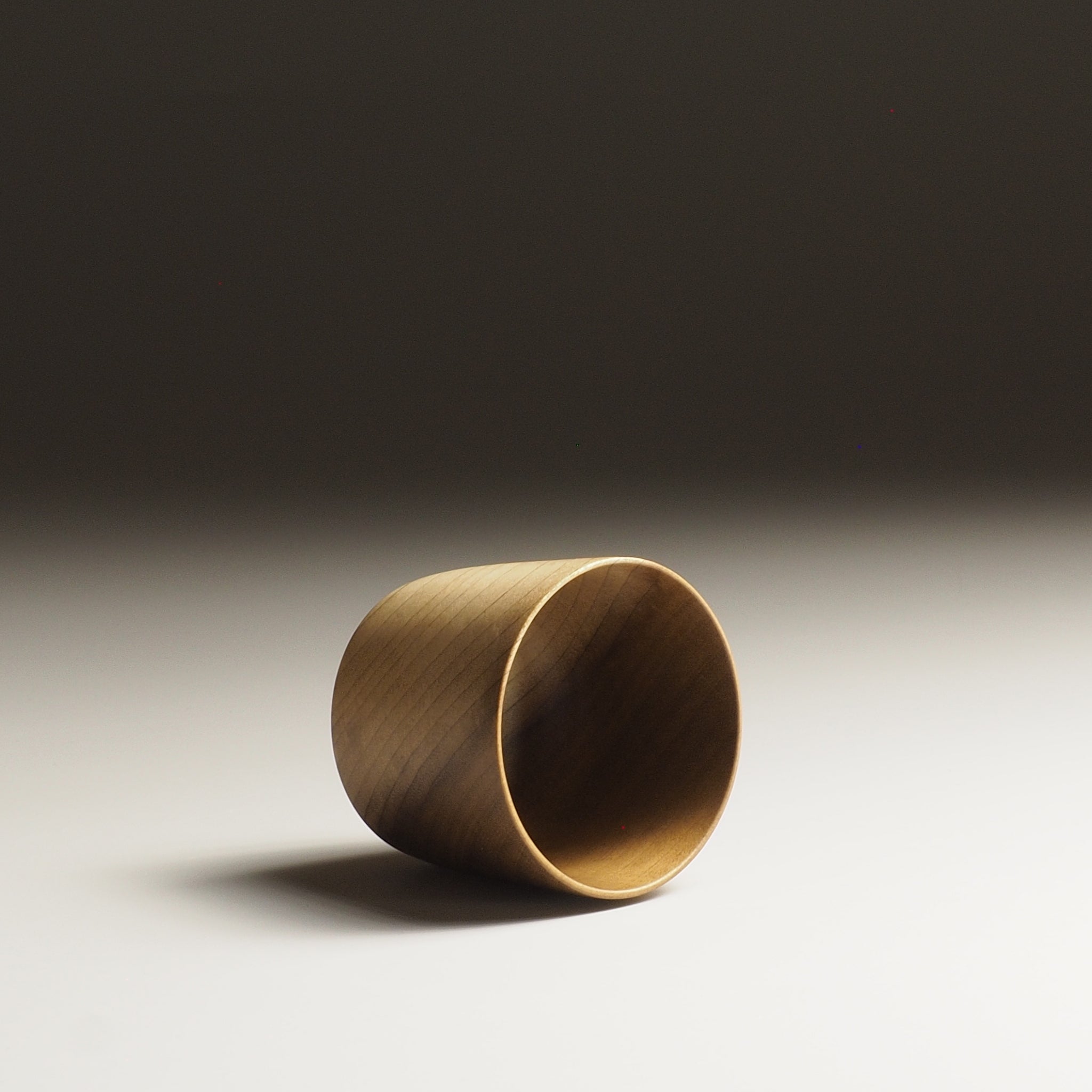 Japanese Cucumber Tree Japanese Wooden Sake cup beige background from top, Tsukushi