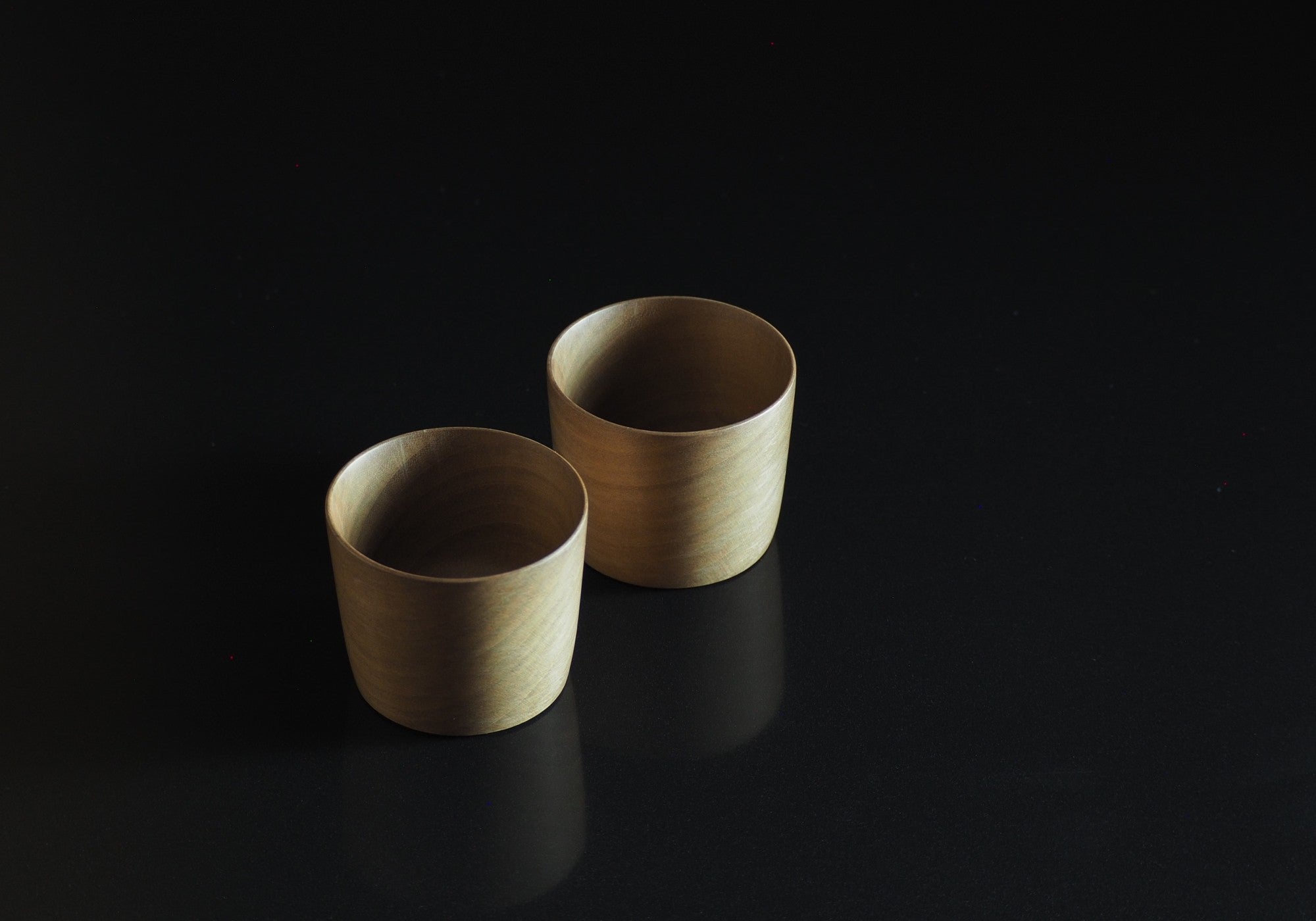 Japanese Cucumber Tree Japanese Wooden Sake cups background black reflection, Tsukushi