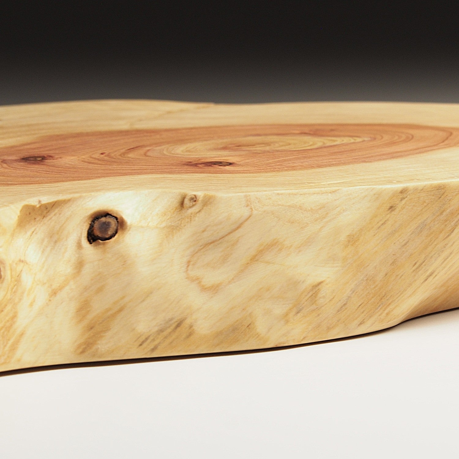 Japanese wooden sushi tray on a dark background. Tsukushi