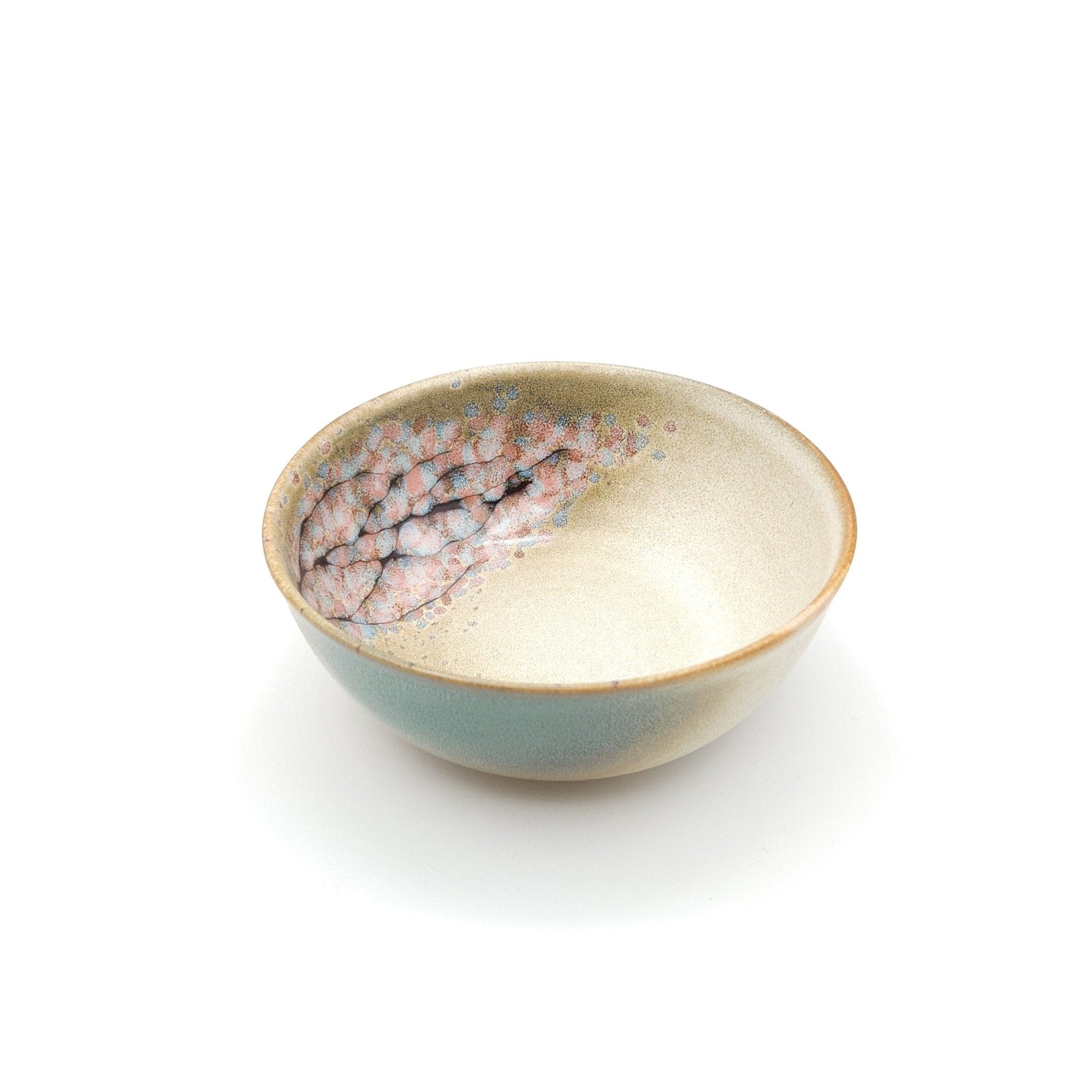 Authentic Japanese pottery salad bowl with cherry blossoms decoration. green and beige color. (side view 1).