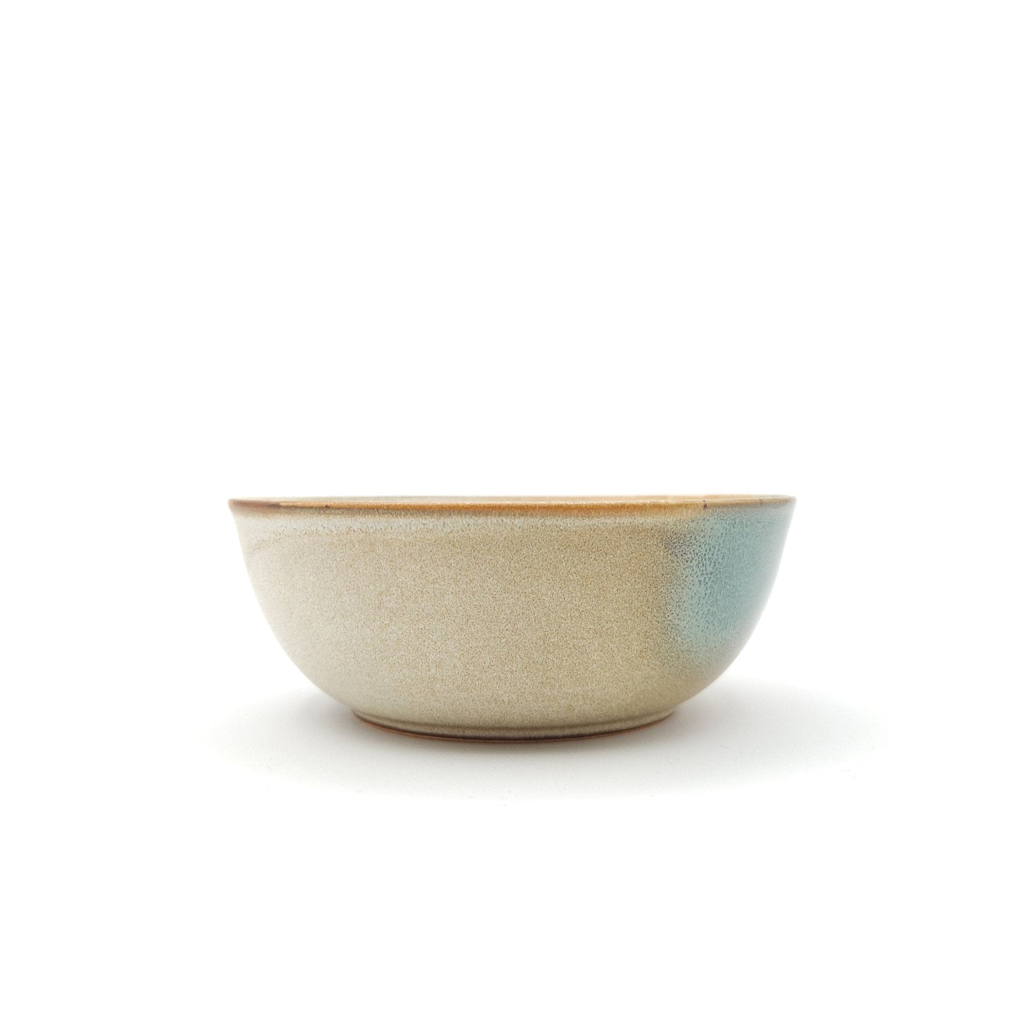 Authentic Japanese pottery salad bowl with cherry blossoms decoration. green and beige color. (side view 2).