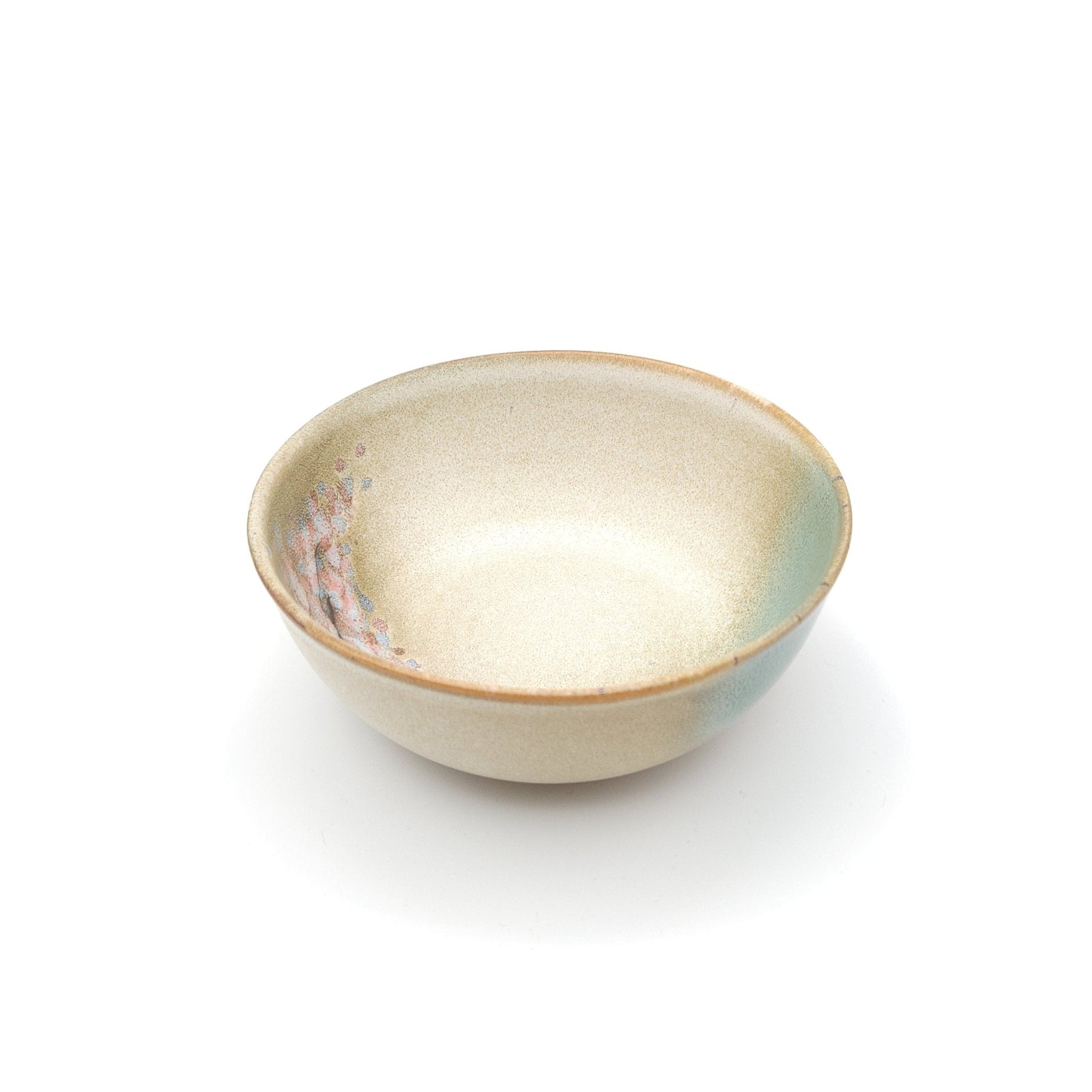 Authentic Japanese pottery salad bowl with cherry blossoms decoration. green and beige color. (side view 3).