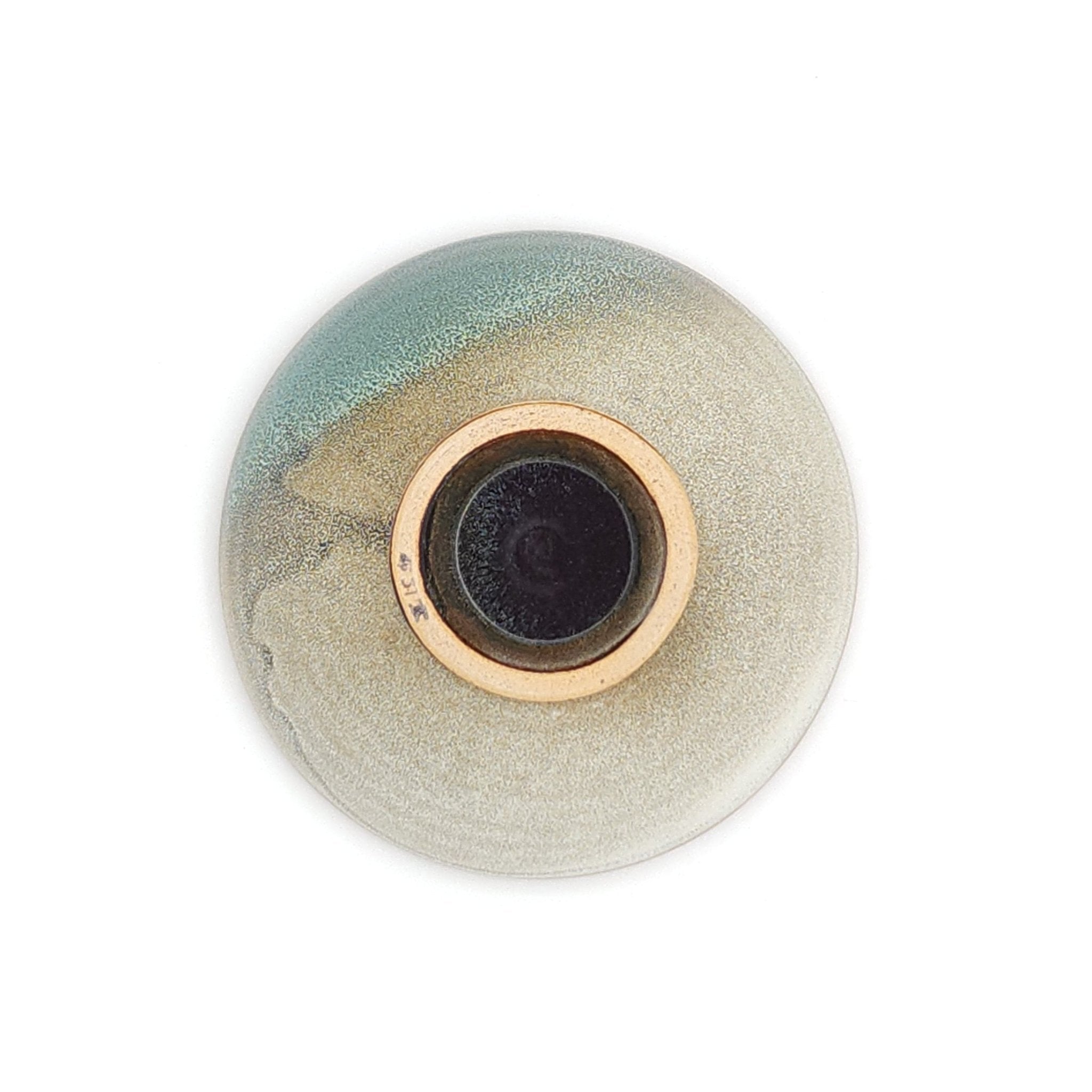 Authentic Japanese pottery bowl with cherry blossoms decoration. Green and beige color. (bottom view 1)