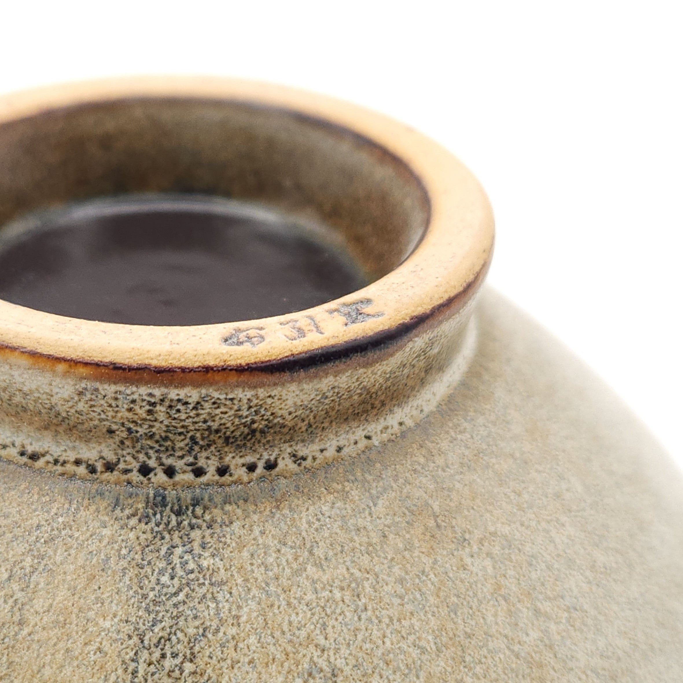 Authentic Japanese pottery bowl with cherry blossoms decoration. Green and beige color. (bottom detail 1)