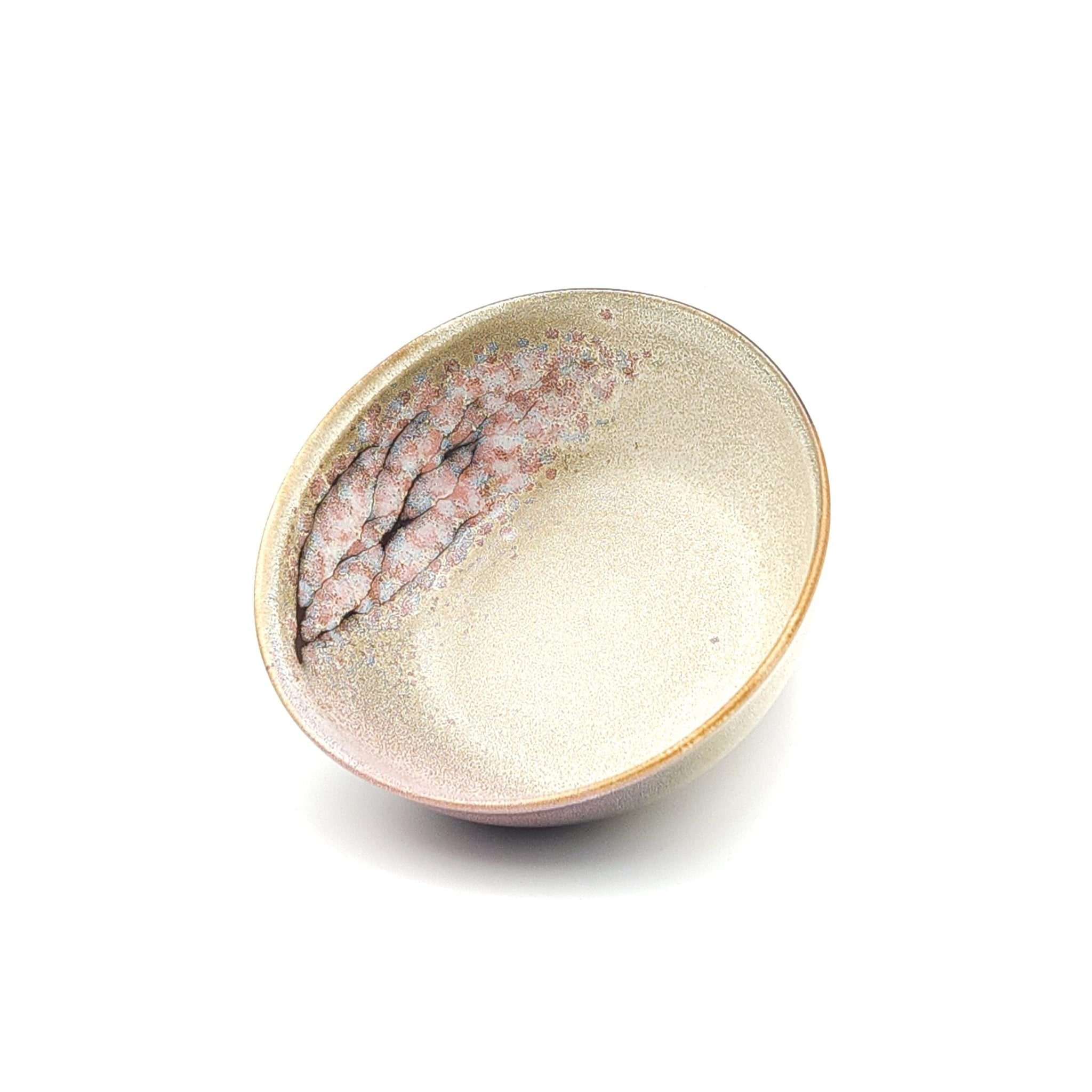Authentic Japanese pottery salad bowl with cherry blossoms decoration. Pink and beige color. (front side view 1).