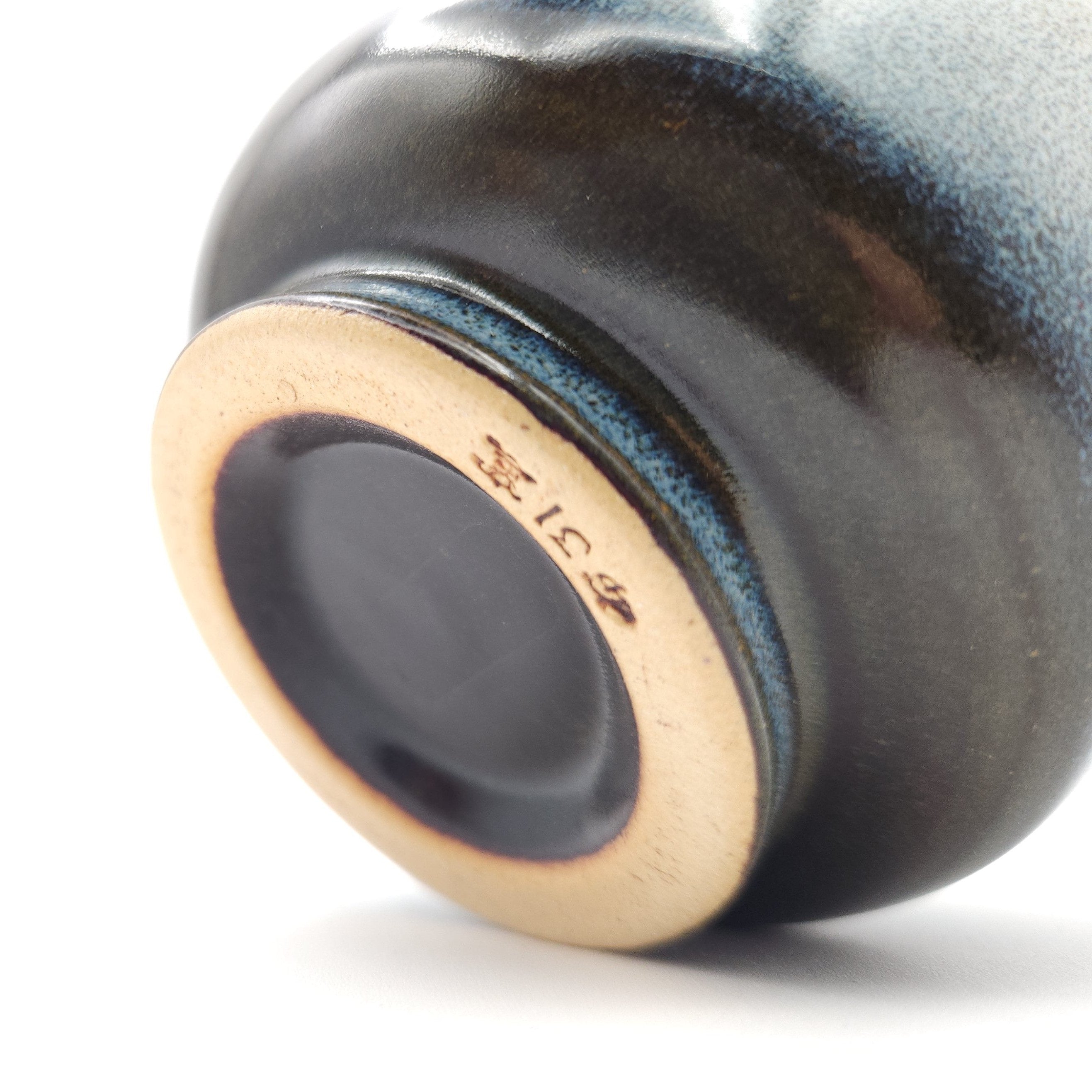 Authentic Japanese pottery teacup with tree decoration. blue and white color.(bottom view 2).