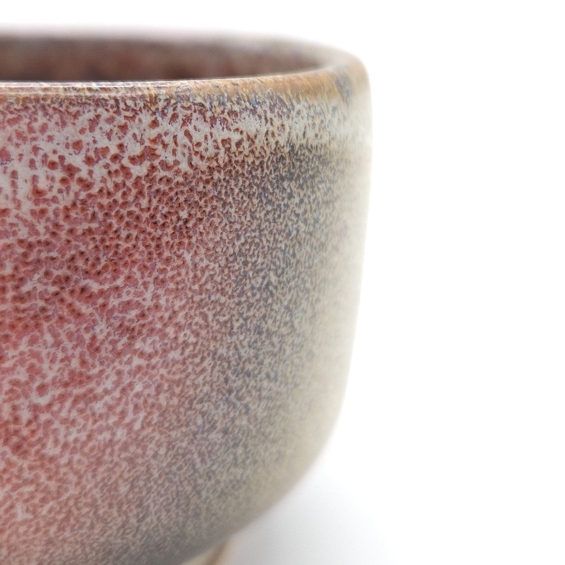 Authentic Japanese pottery teacup with cherry blossoms decoration. pick and beige color.  (side detail view 1).