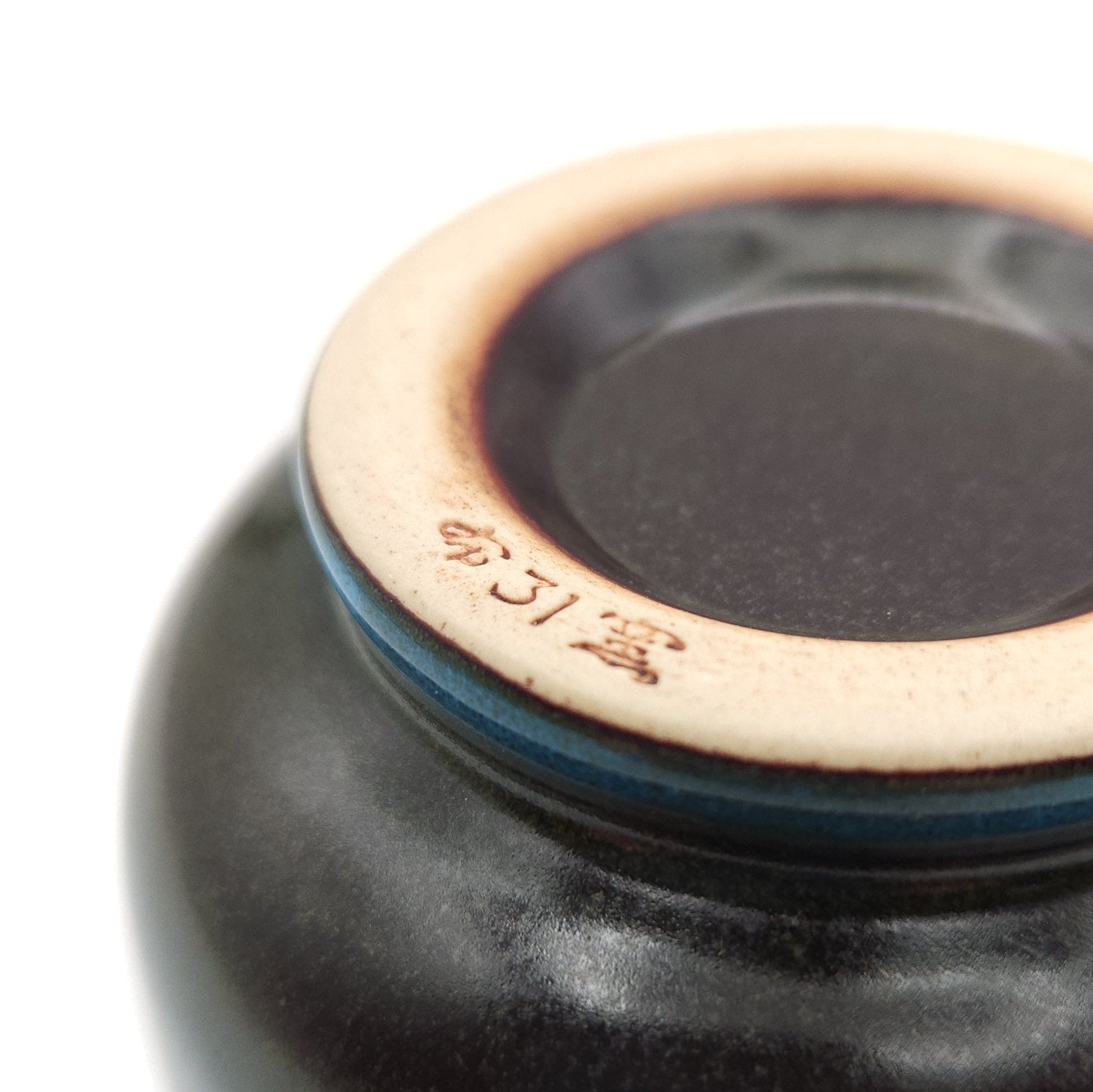 Authentic Japanese pottery teacup with tree pattern decoration. blue color.  (bottom view 2).