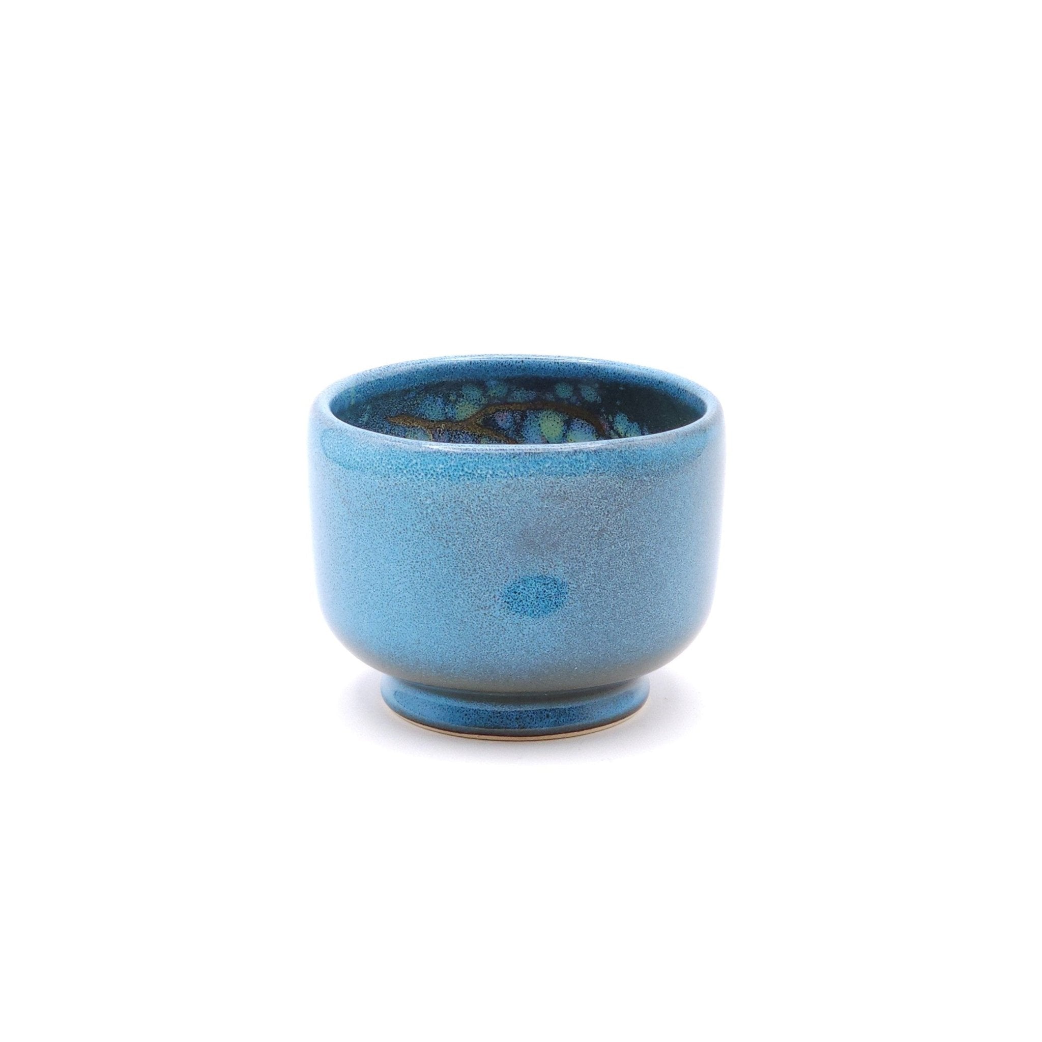 Authentic Japanese pottery teacup with tree pattern decoration. blue color. (side view 2).