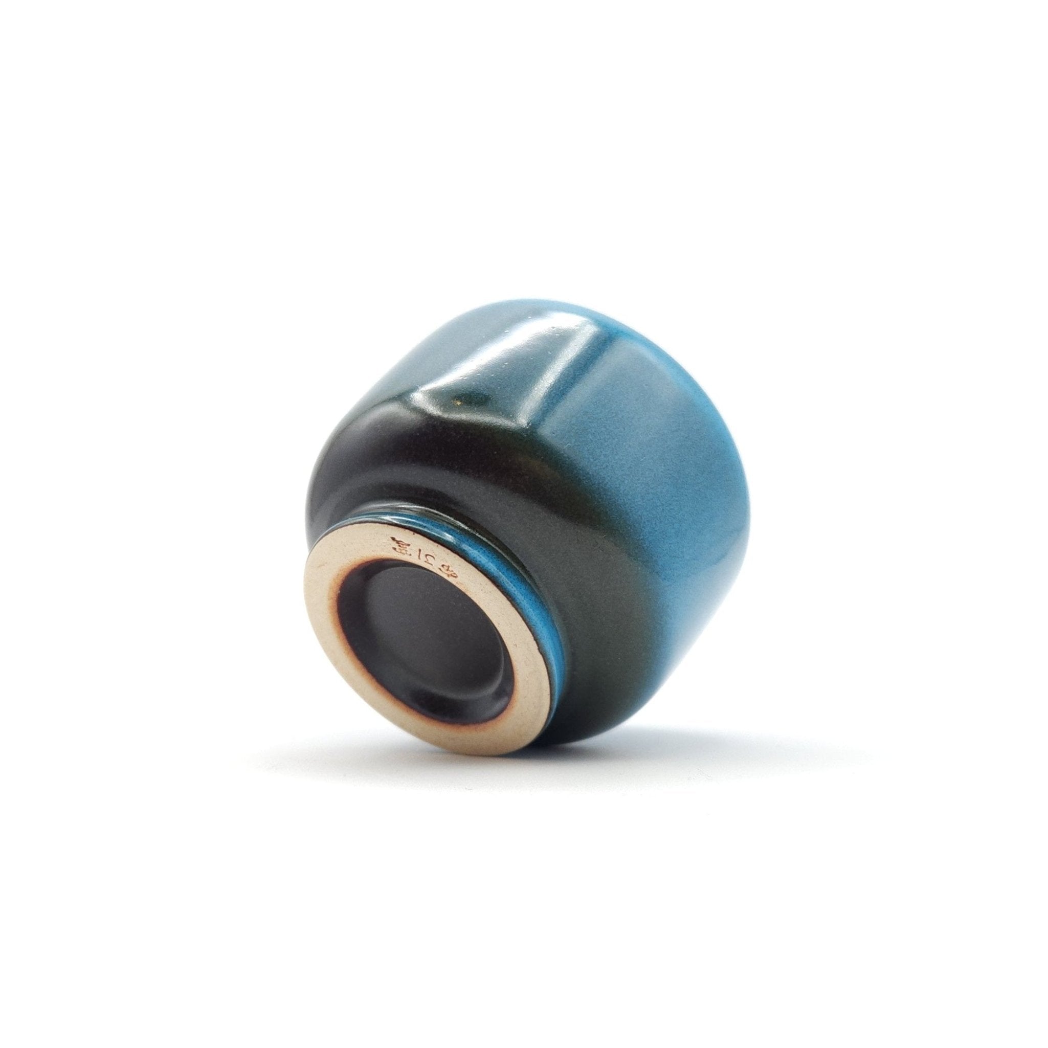 Authentic Japanese pottery teacup with tree pattern decoration. blue color. (side view 4).