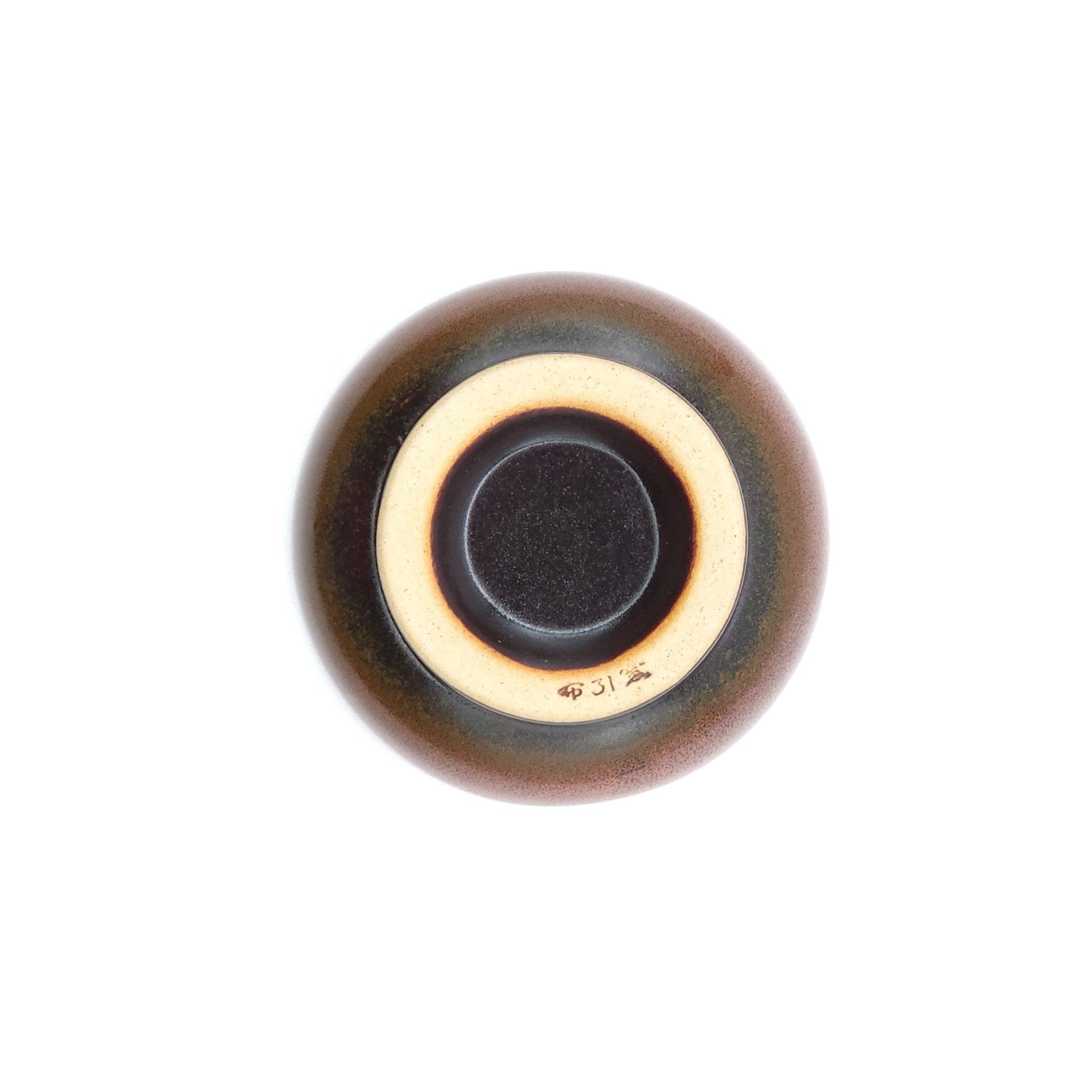 Authentic Japanese pottery teacup with tree pattern decoration. pink color. (bottom view 1).