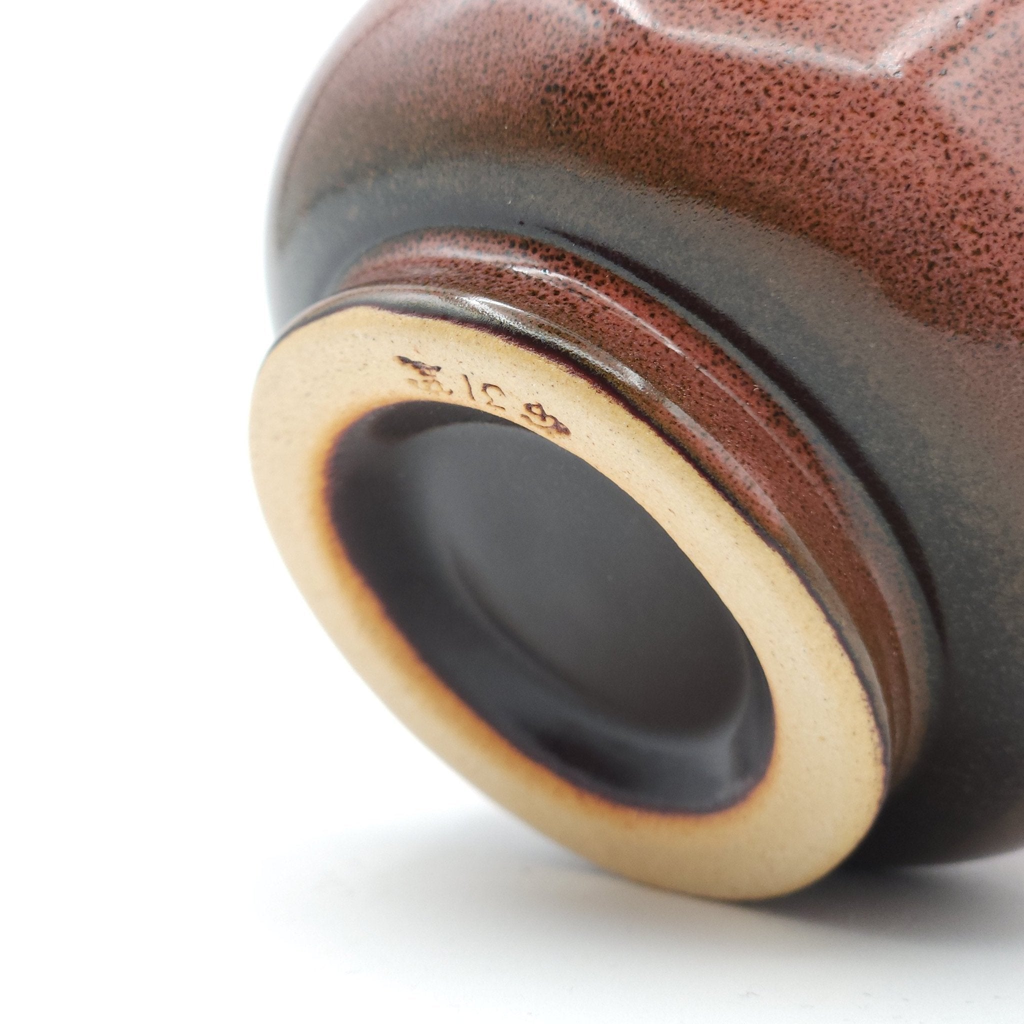 Authentic Japanese pottery teacup with tree pattern decoration. pink color. (bottom detail view 1).