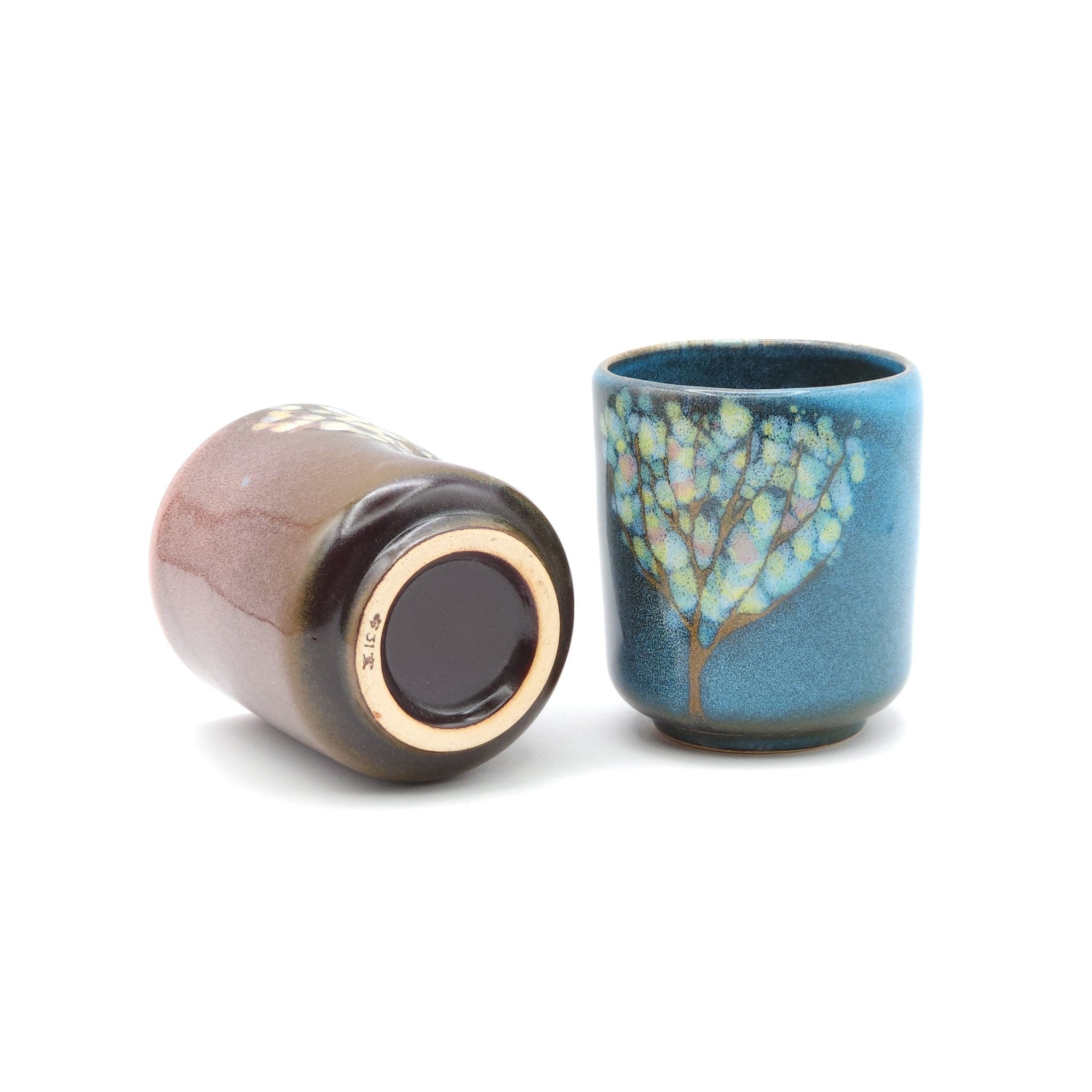 Authentic Japanese pottery teacup tall with tree pattern decoration. blue color. (pink and blue pair view 3).