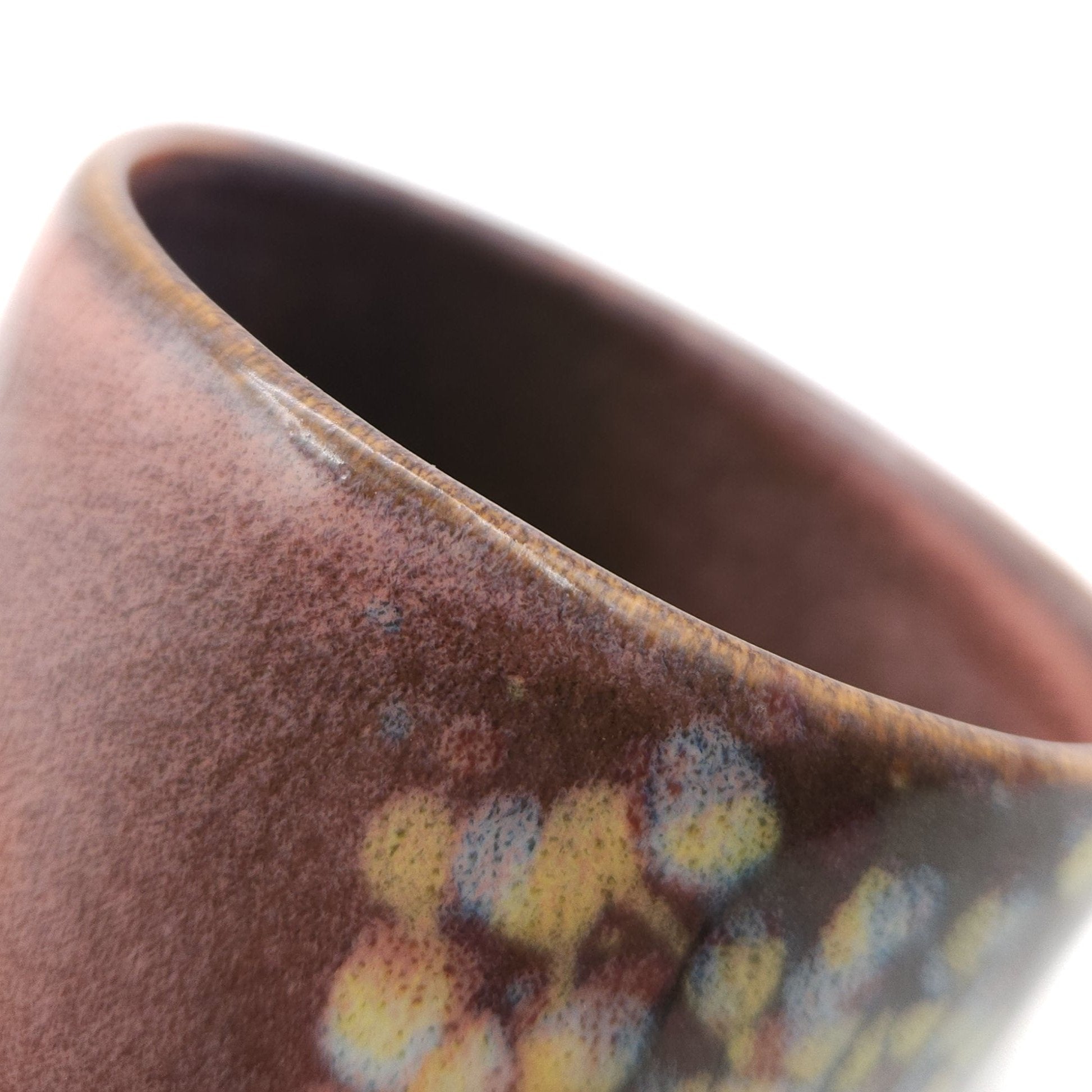 Authentic Japanese pottery teacup tall with tree pattern decoration. pink color. (side detail view 1).