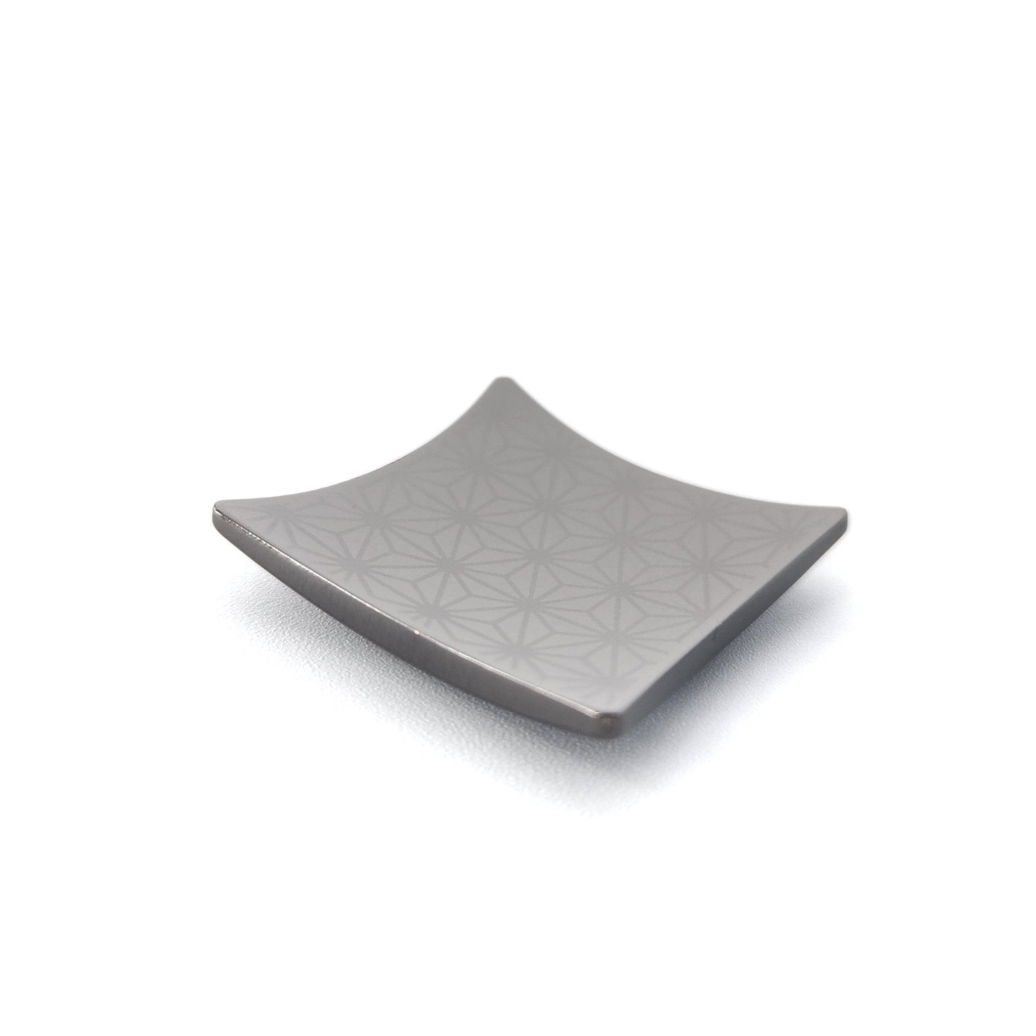 A Japanese Chopsticks rest in black metal with Nezuko pattern