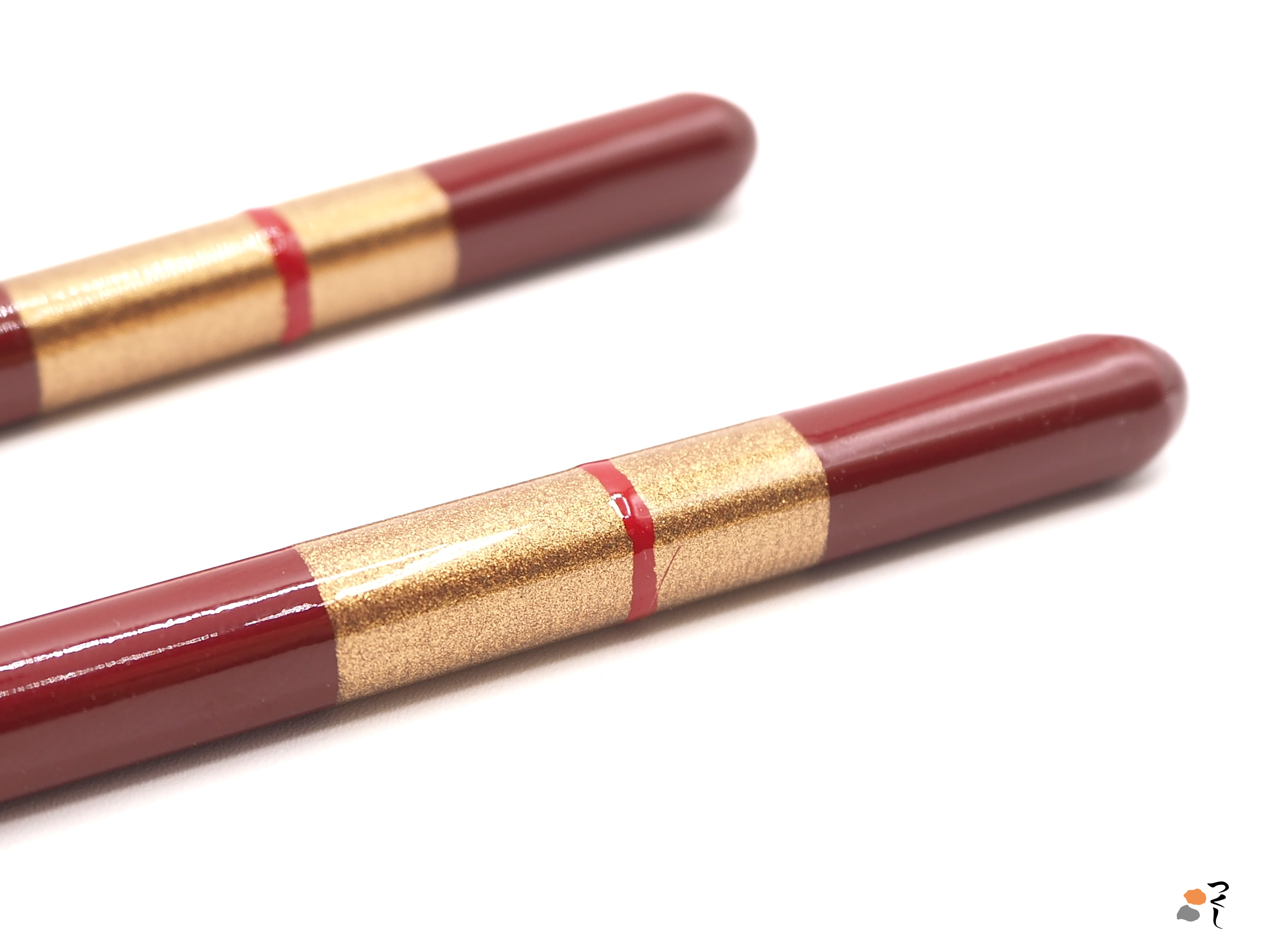 Detail of red Japanese Chopsticks golden motif