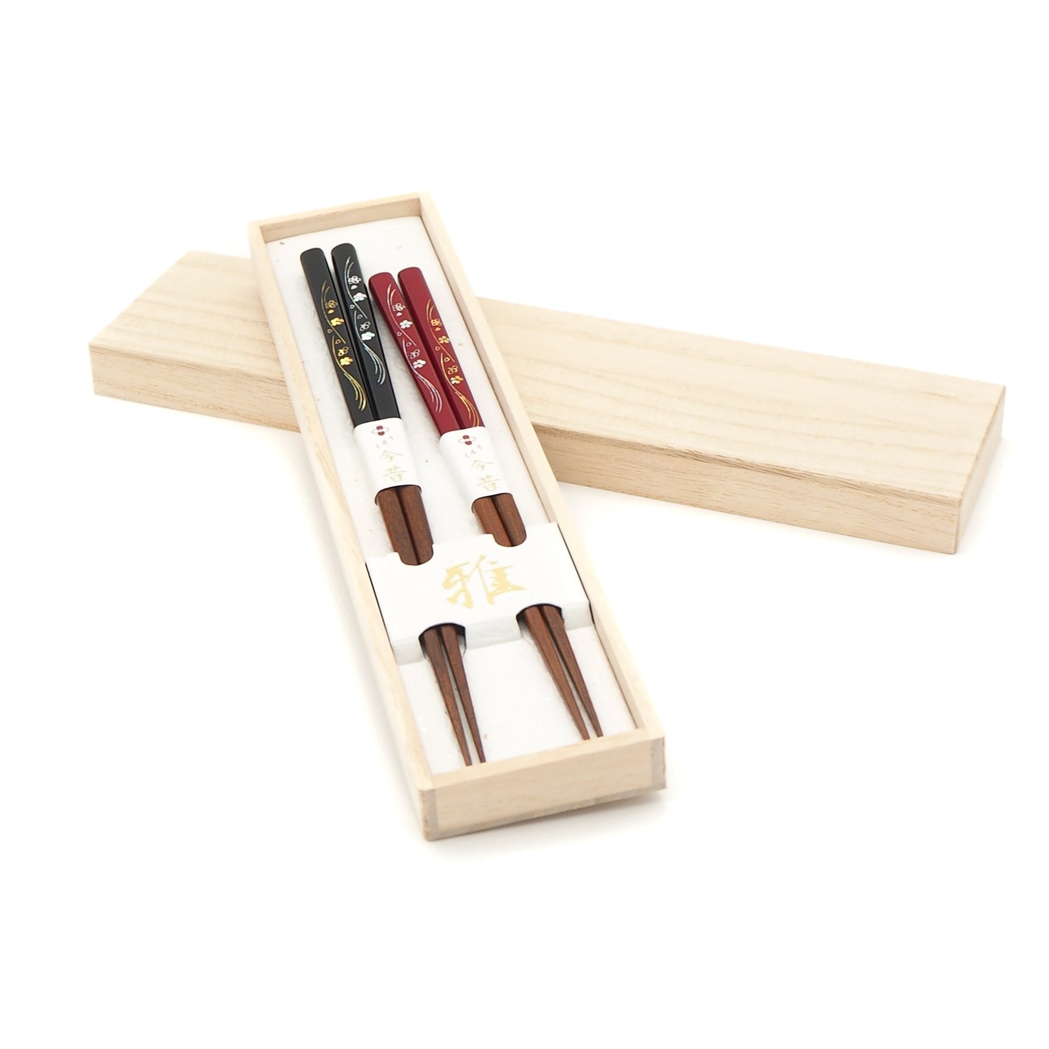 Red and black Japanese chopsticks with cherry blossom motifs with box