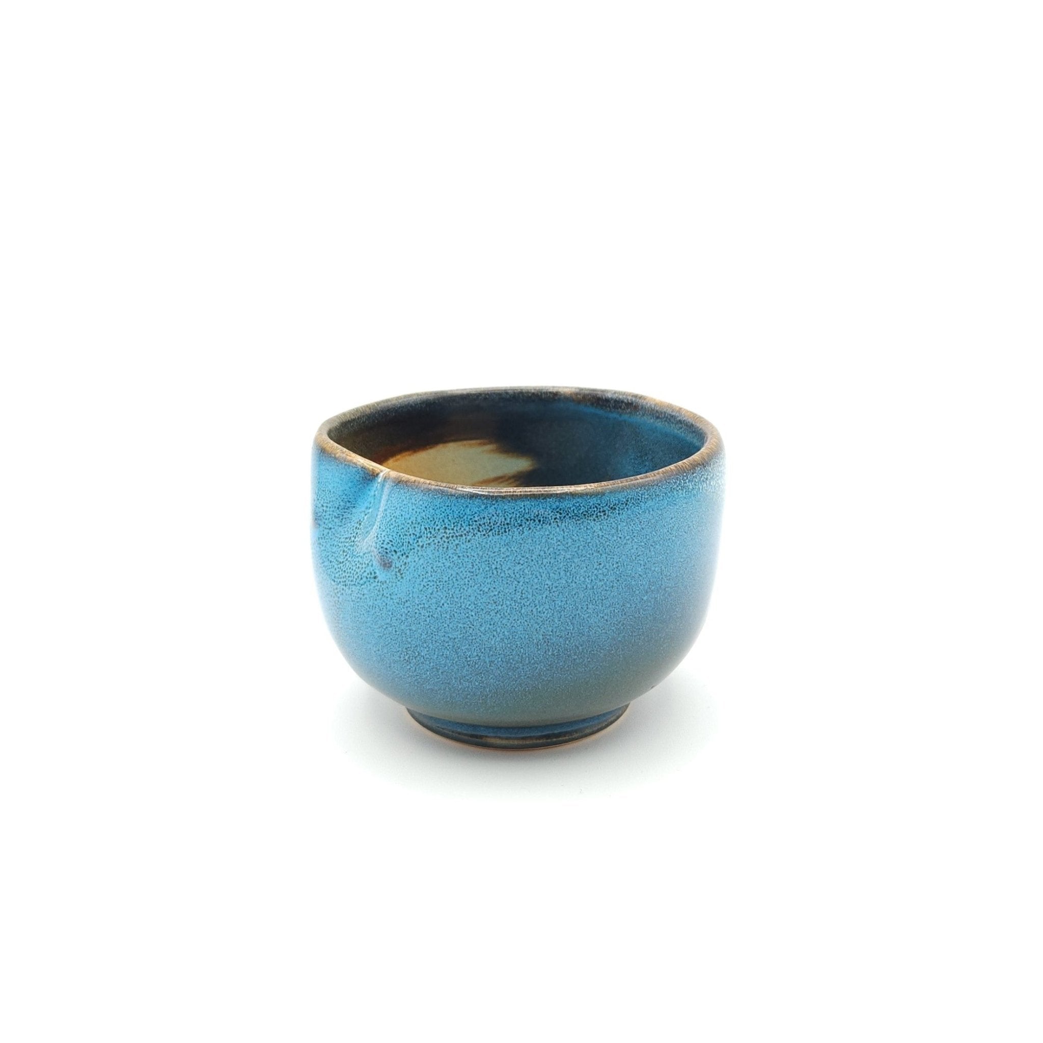 Side view of a Japanese blue Teacup made of pottery with an Owl motif. 3