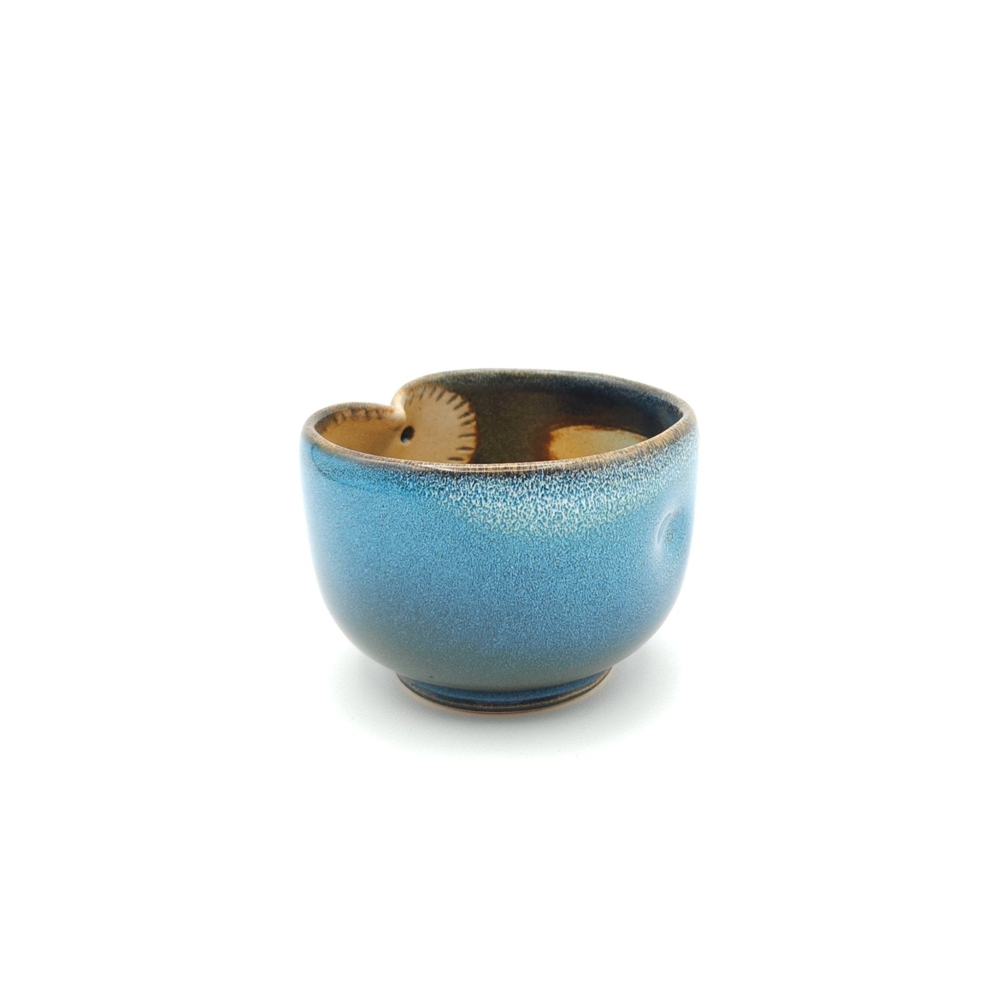 Side view of a Japanese blue Teacup made of pottery with an Owl motif. 4