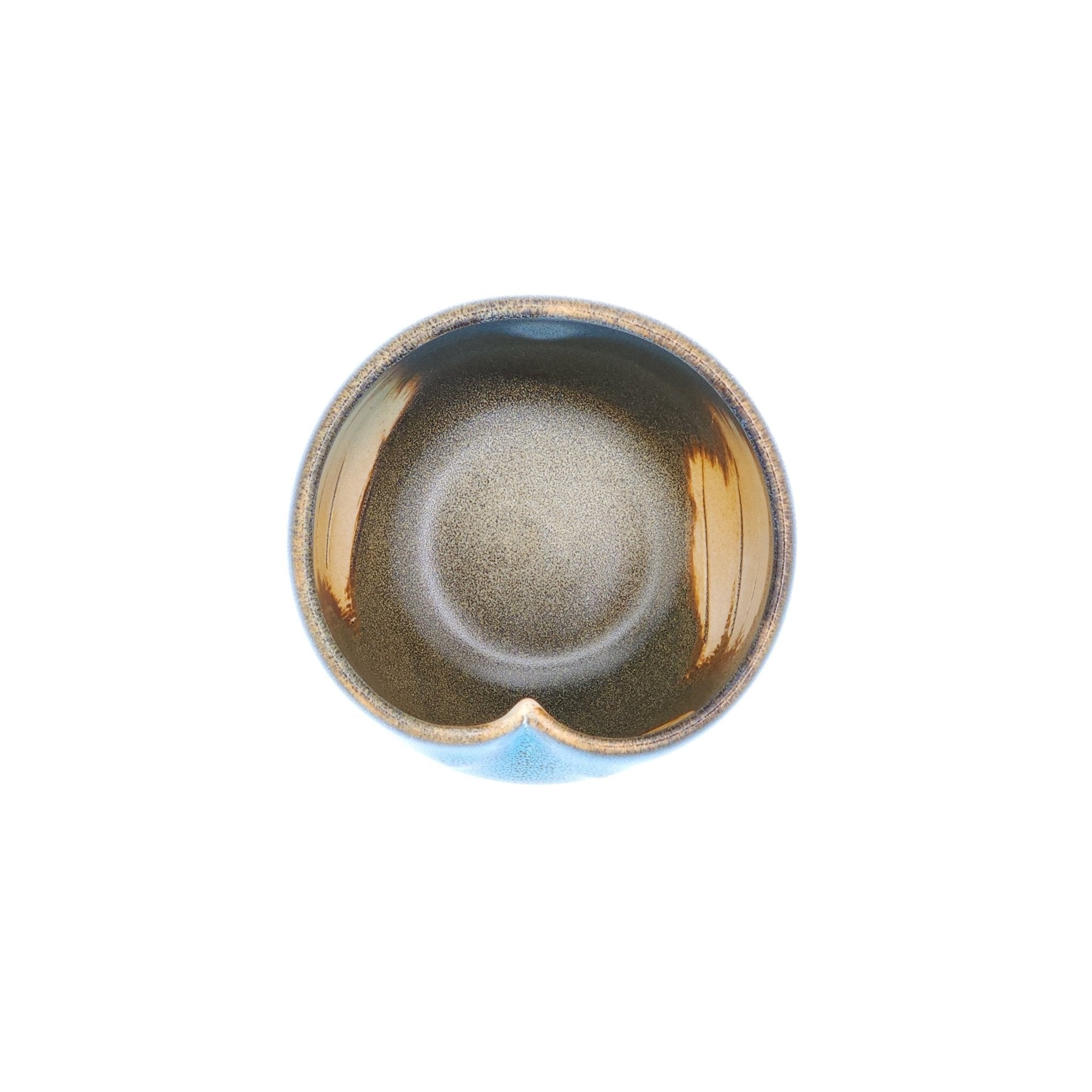 Top view of a Japanese blue Teacup made of pottery with an Owl motif.