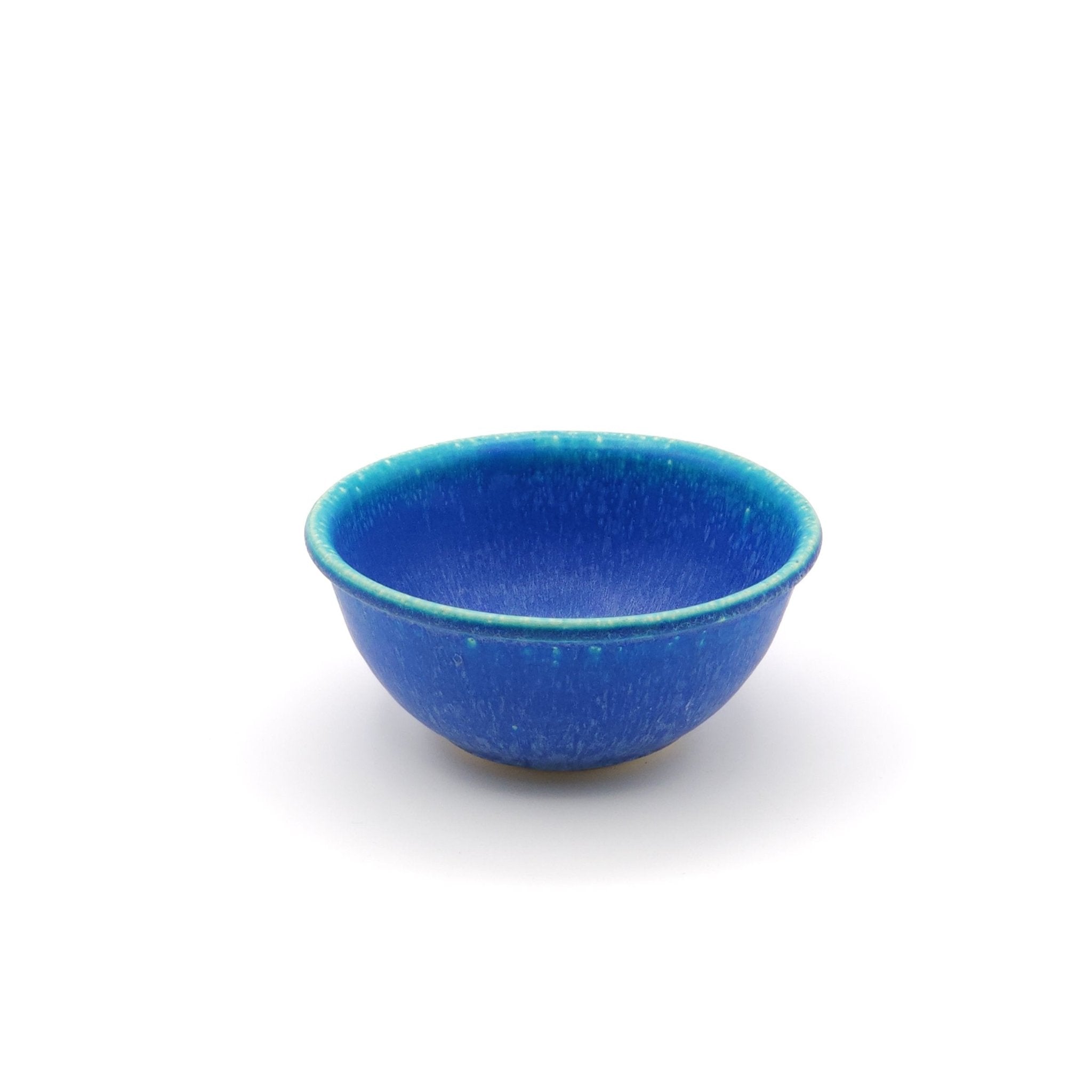 Front view of a Japanese pottery bowl, turquoise color. 2