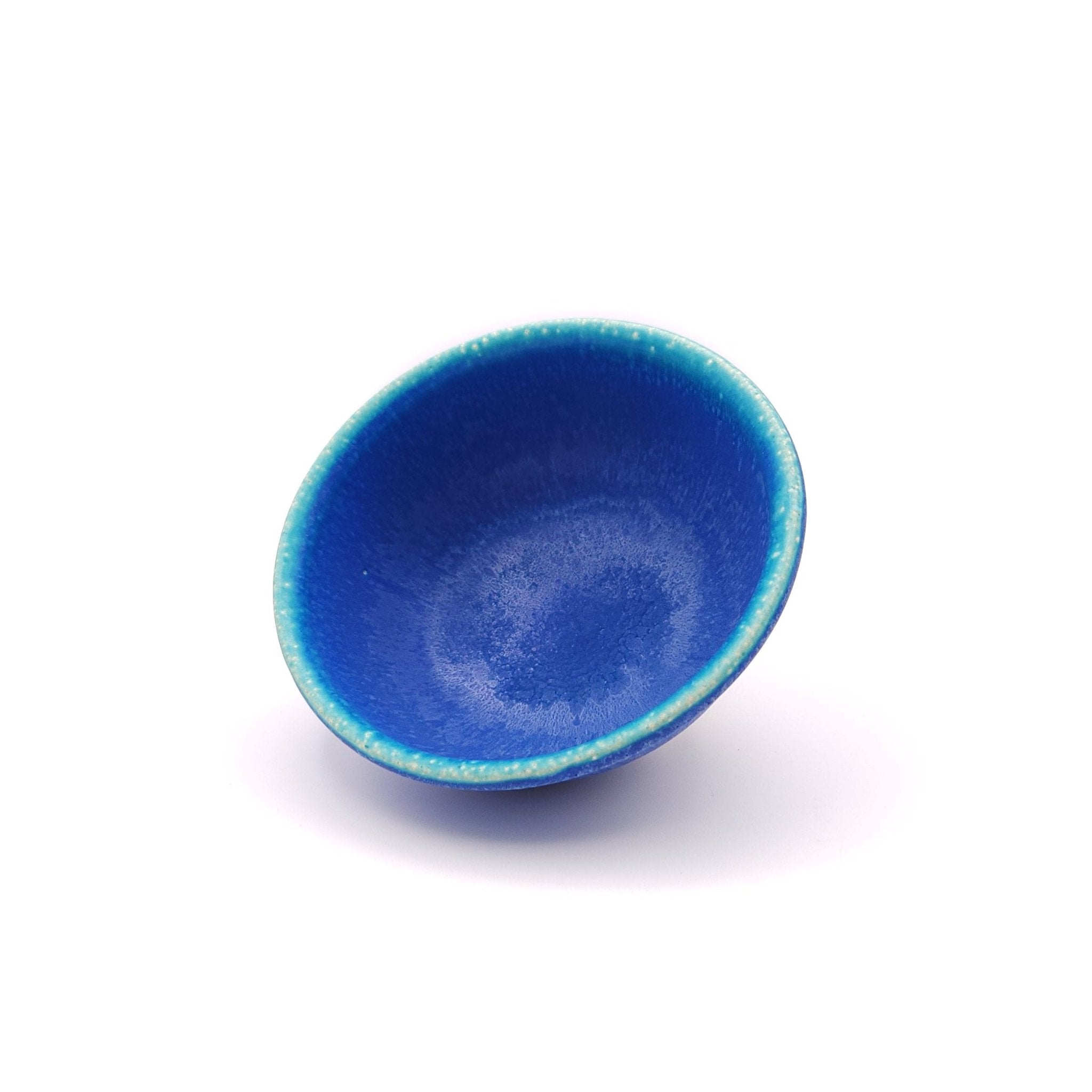 oblique view of a Japanese pottery bowl, turquoise color. 2