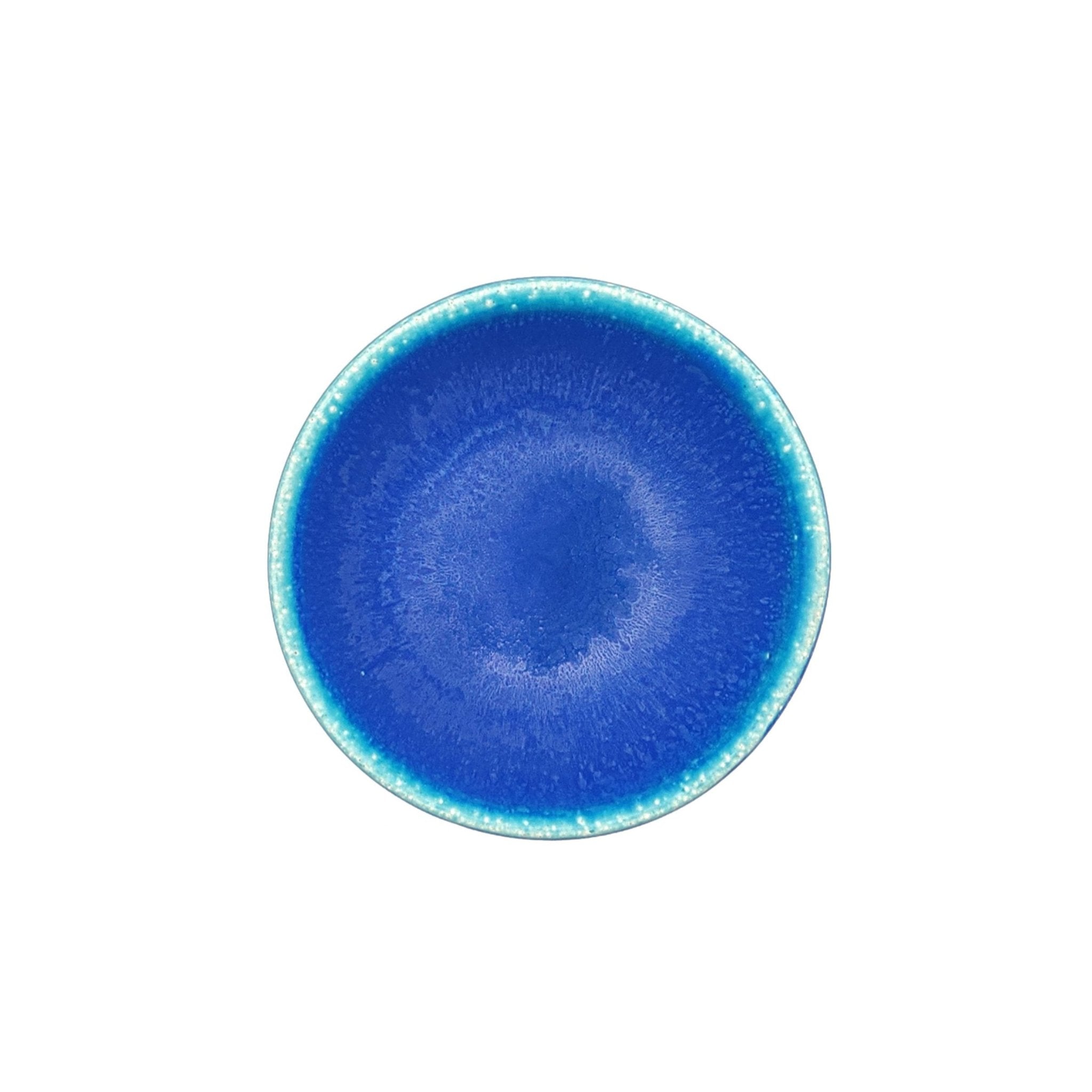 Top view of a Japanese pottery bowl, turquoise color.