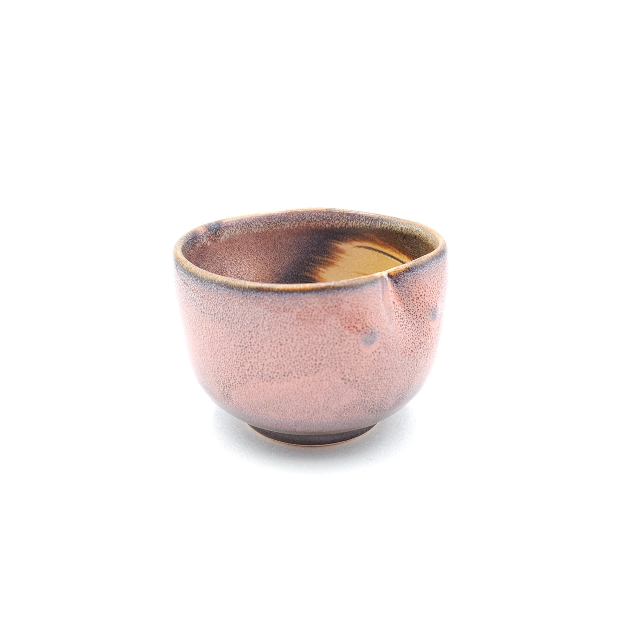 Back side view of a Japanese pink Teacup made of pottery with an Owl motif. 2