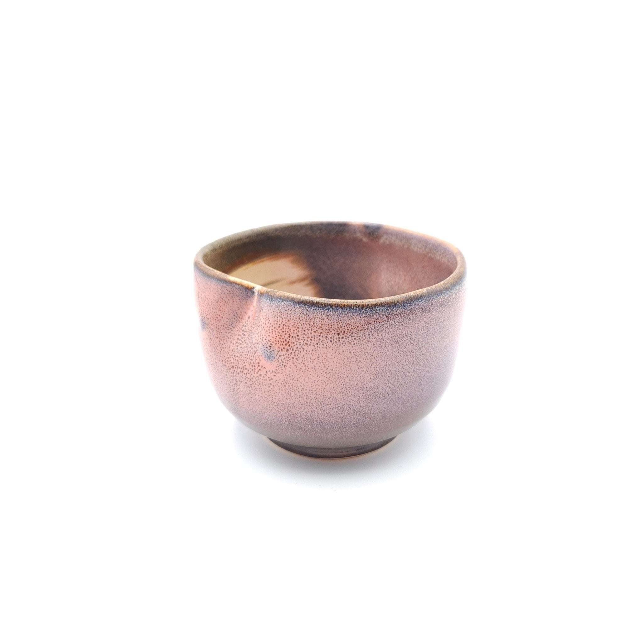Side view of a Japanese pink Teacup made of pottery with an Owl motif. 4