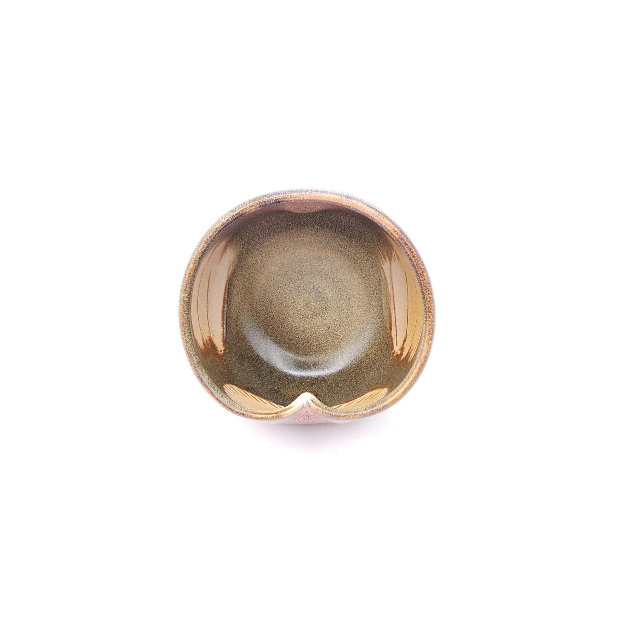 Top view of a Japanese pink Teacup made of pottery with an Owl motif.