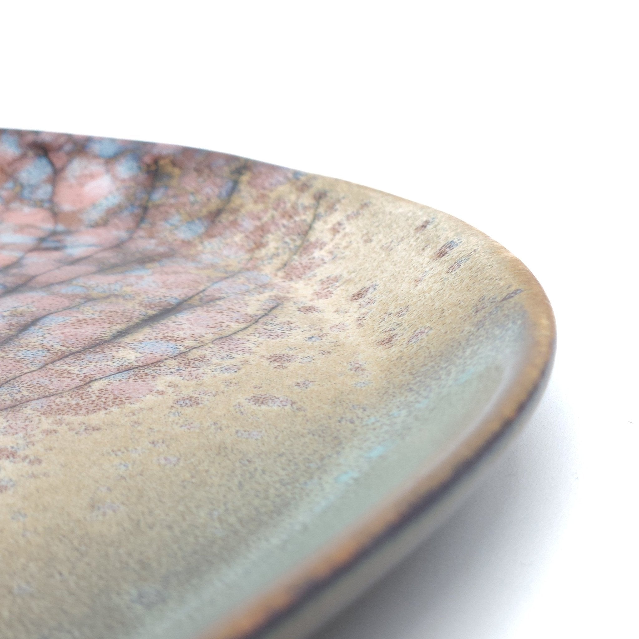 A detail of a Japanese plate made of pottery with cherry blossoms motif in green background. 3