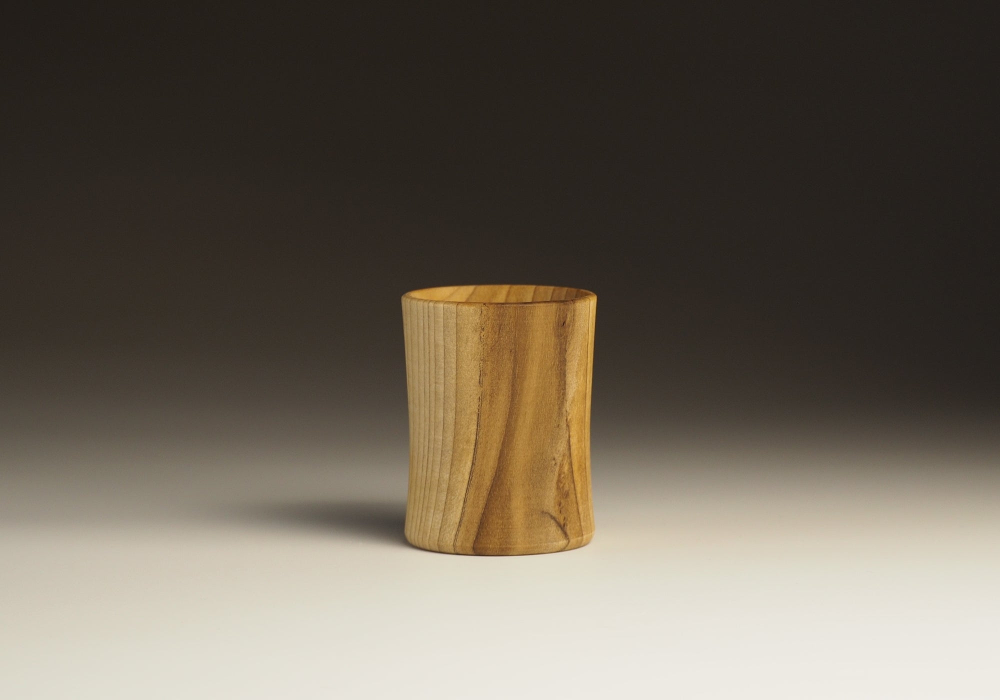 Wood Sake cup on shaded background, Tsukushi