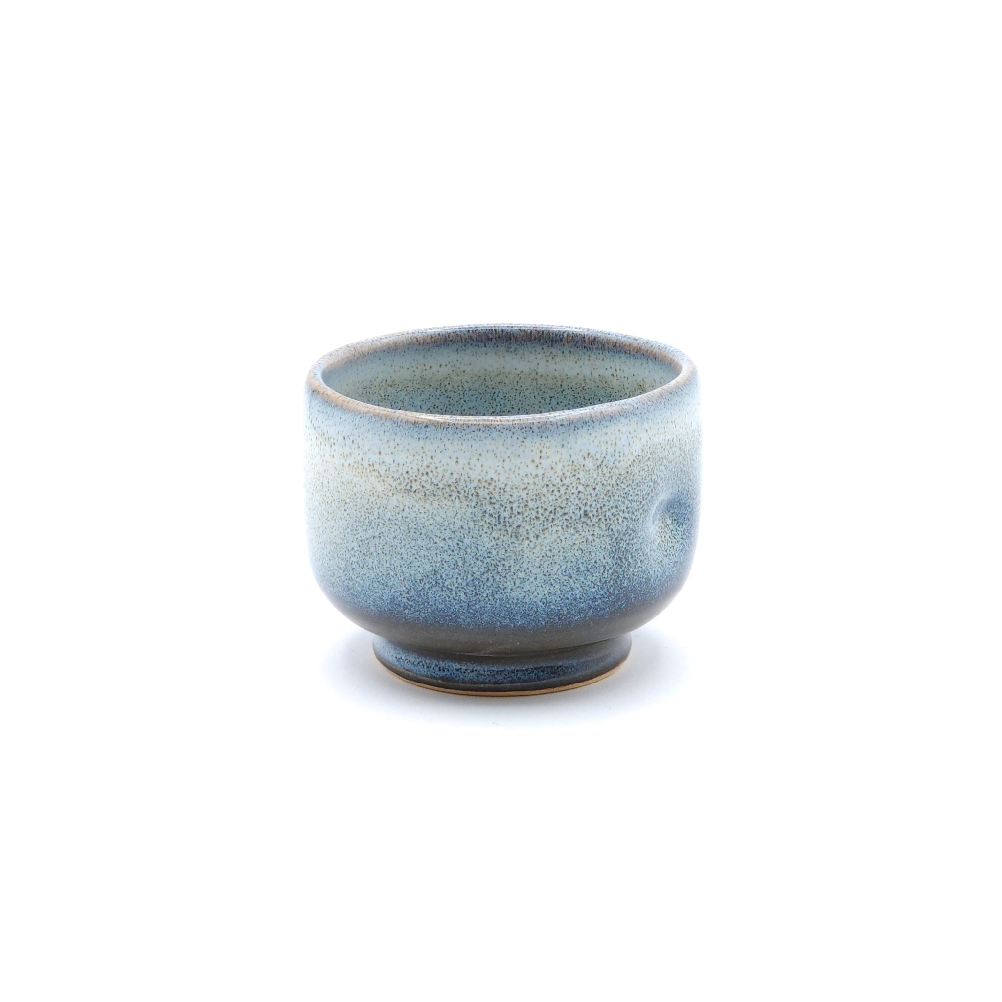 A blue Japanese Pottery Teacup, front top view. Tsukushi