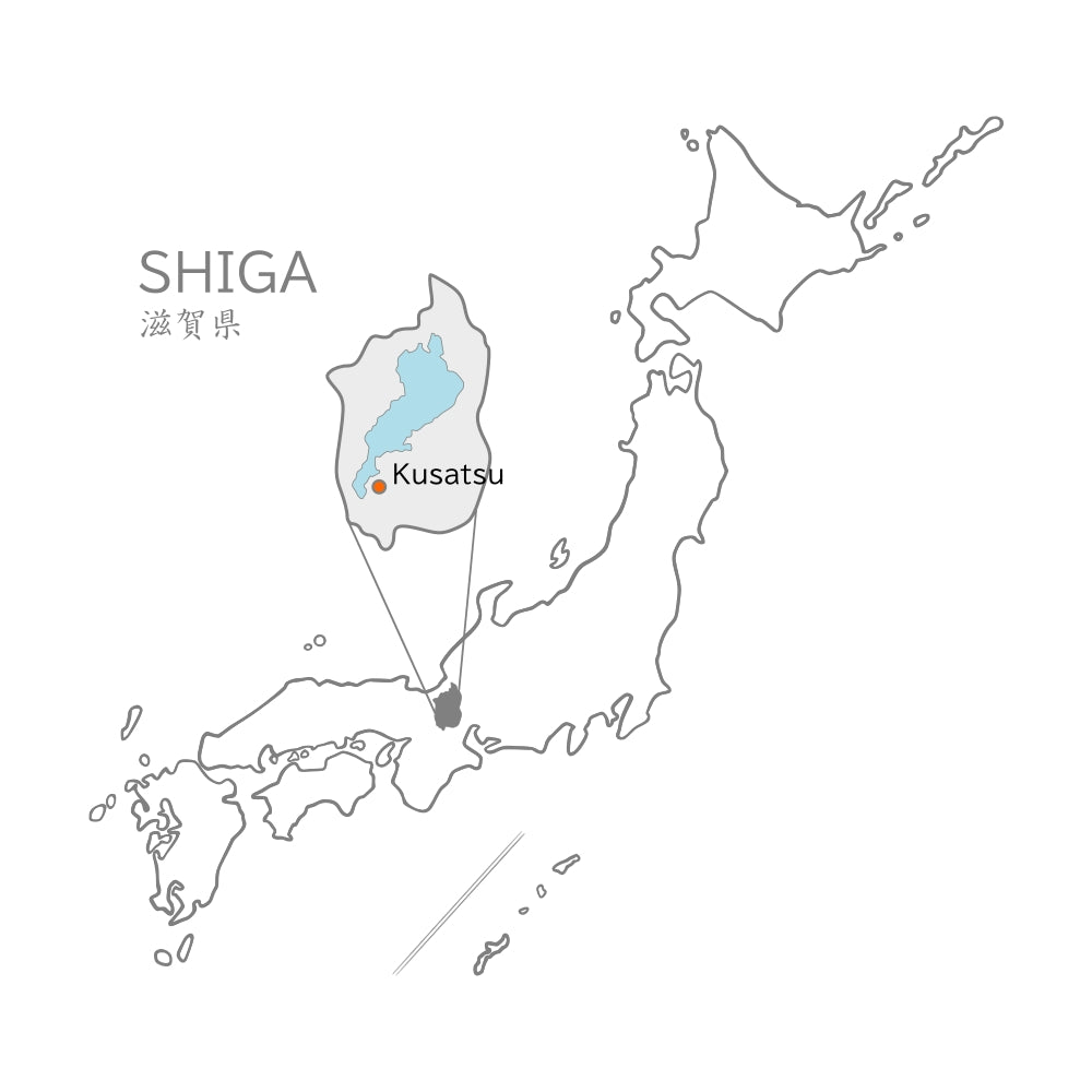 A map of Japan highlighting Shiga prefecture with Kusatsu marked on a white background. Tsukushi