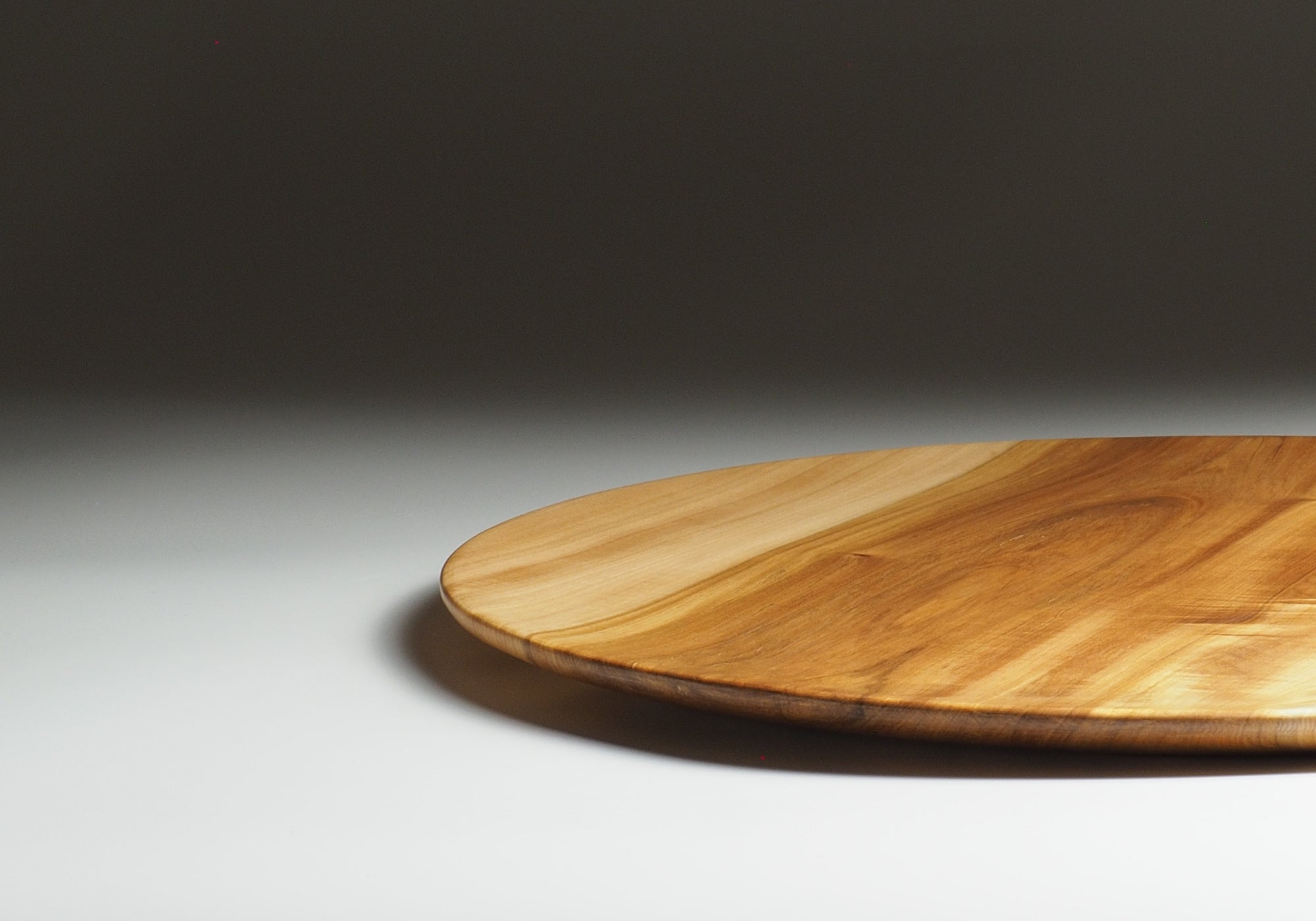 Japanese wood plate on a gray gradation background. Tsukushi