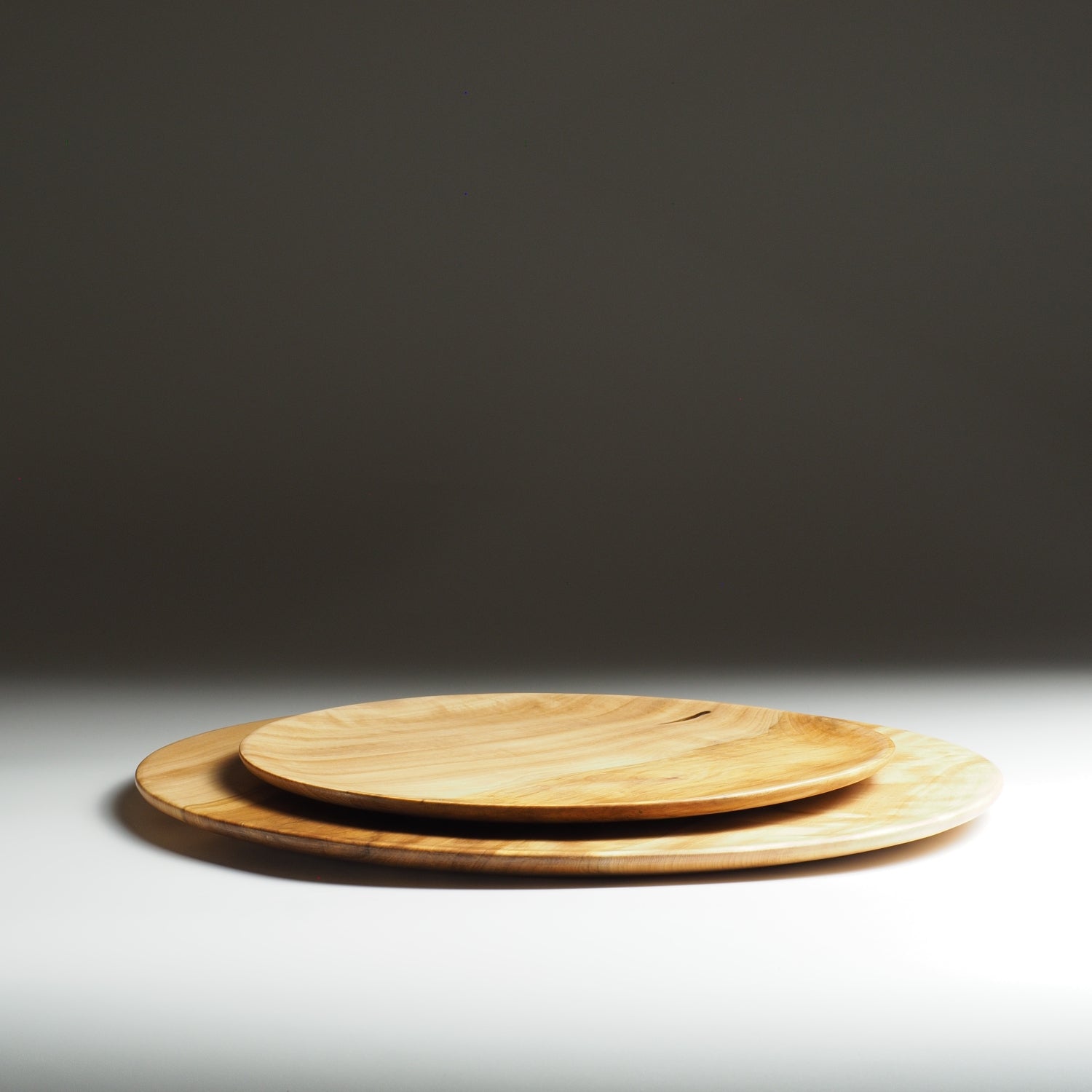 Set of Japanese wooden plates on a gradient background. Tsukushi