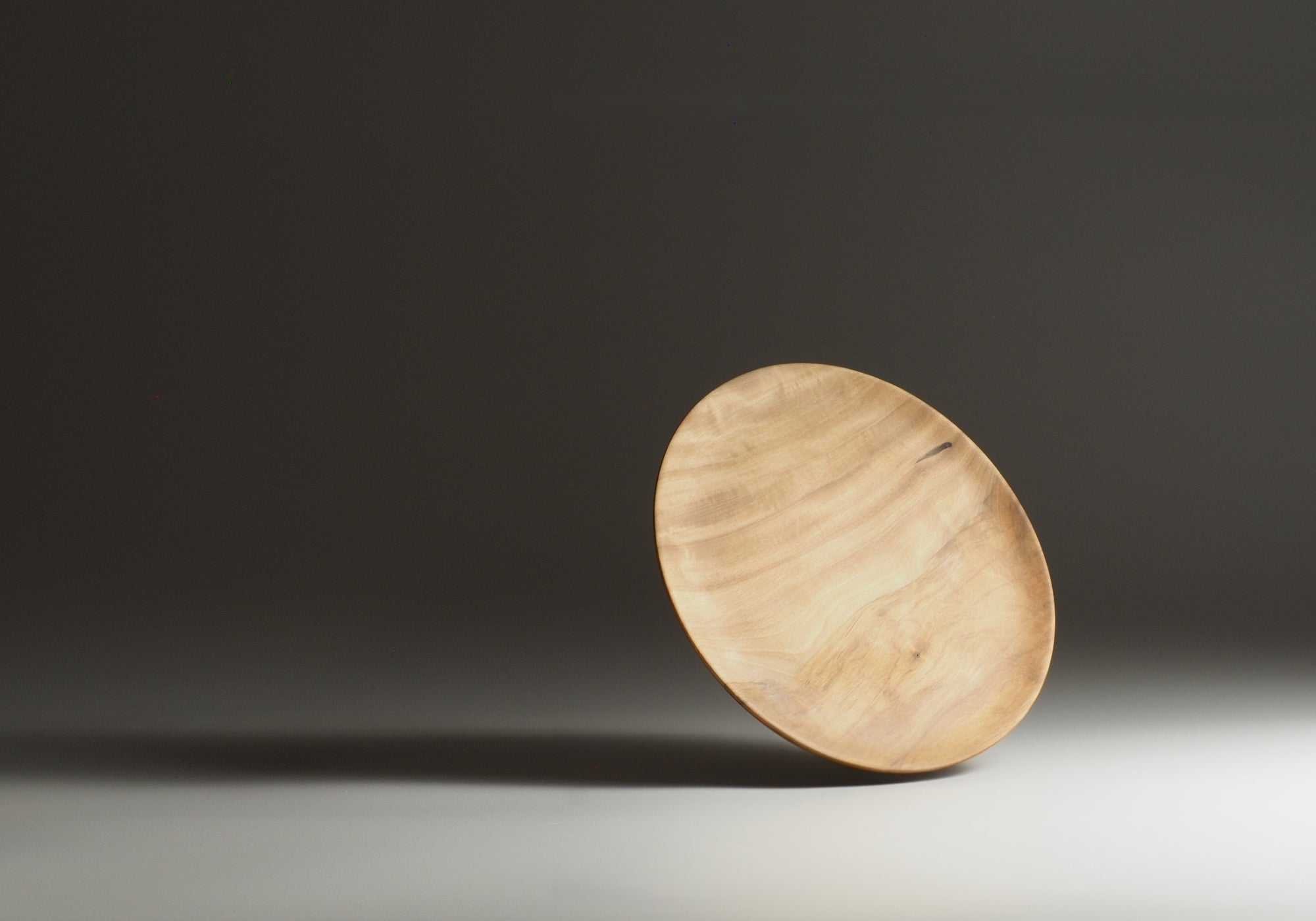 Japanese wood plate on a gray gradation background. Tsukushi