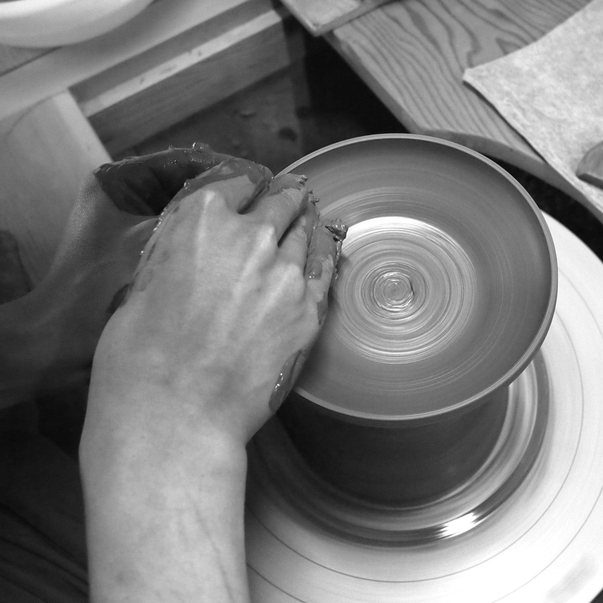 Working on a pottery wheel, shaping a Japanese ceramic bowl, Tsukushi